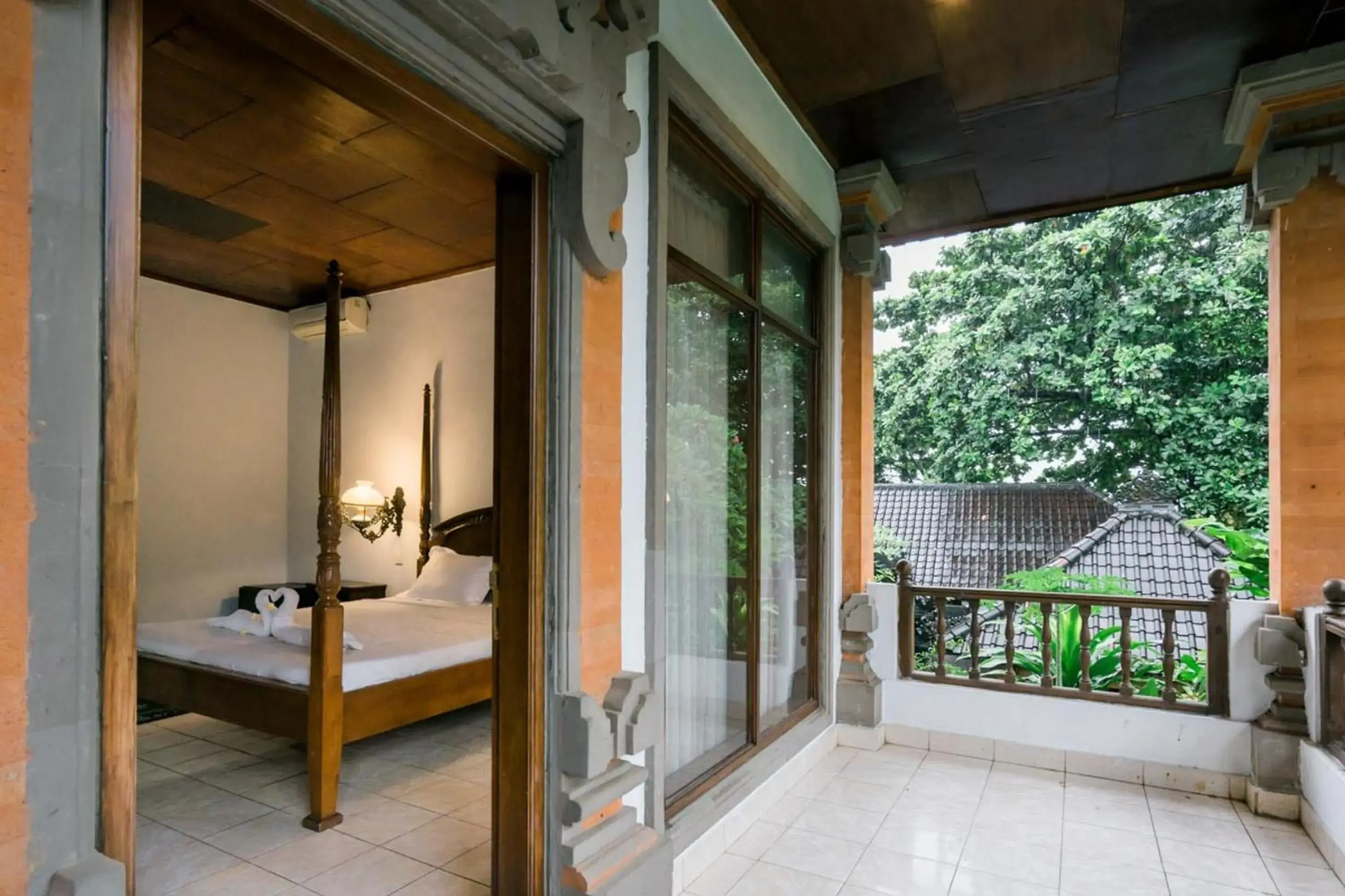 Balcony/Terrace, Bed in Urbanview Hotel Ananda Beach Sanur Balcony/Terrace, Bed in Urbanview Hotel Ananda Beach Sanur