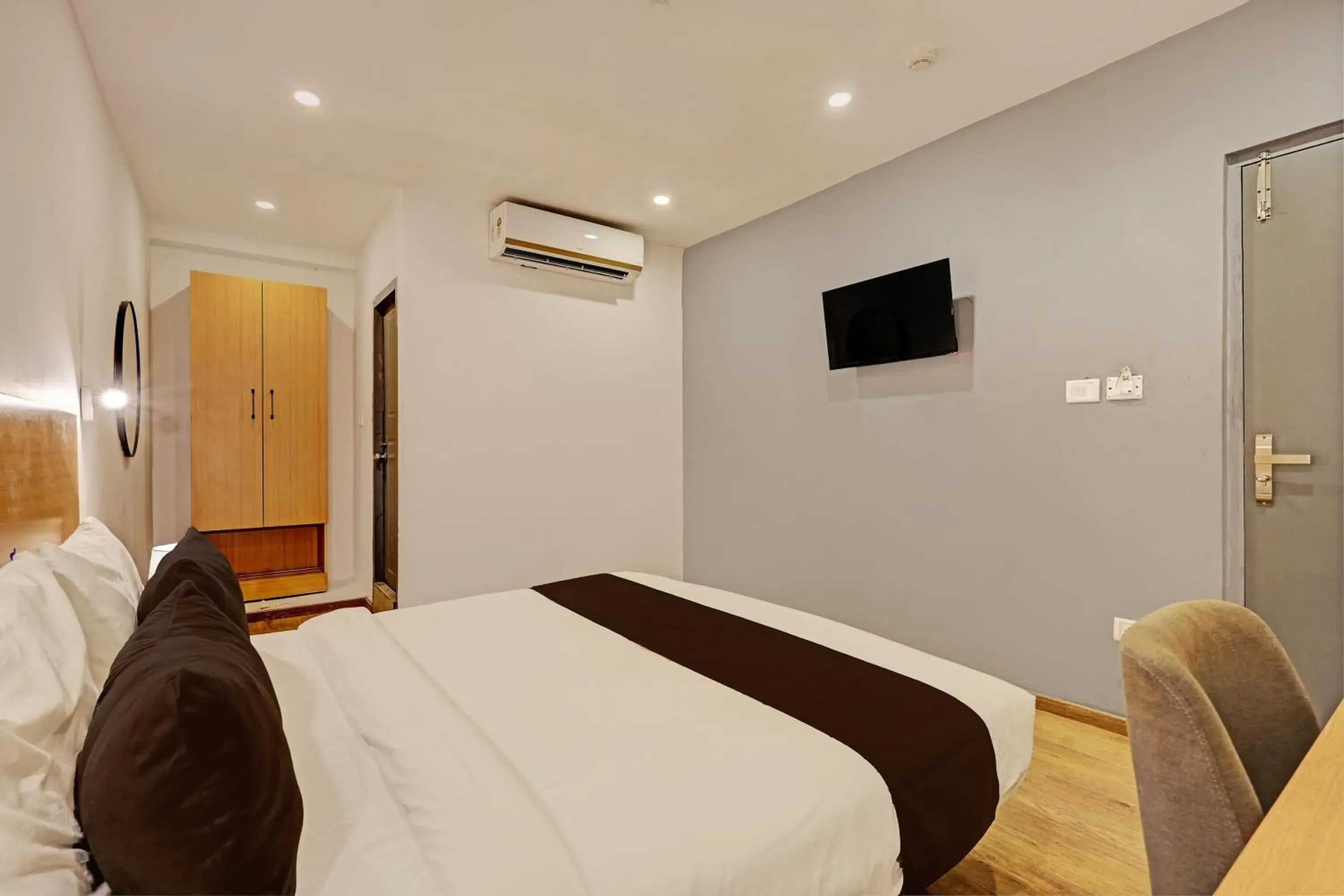 Bedroom, Bed in Super Townhouse Ramamurthy Nagar Formerly Navya International Bedroom, Bed in Super Townhouse Ramamurthy Nagar Formerly Navya International