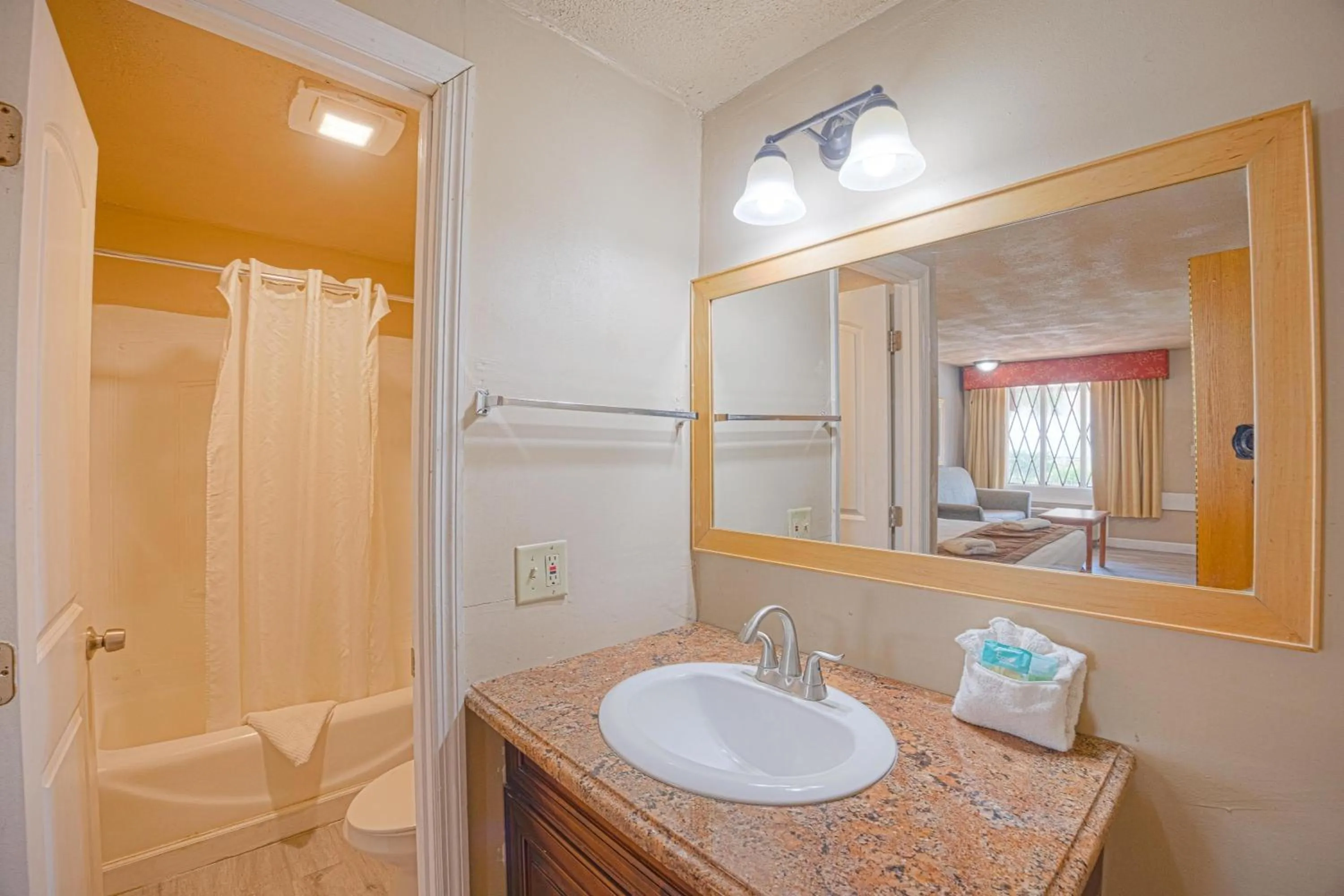 Bathroom in Liberty Garden Inn by OYO Kissimmee near Disney World