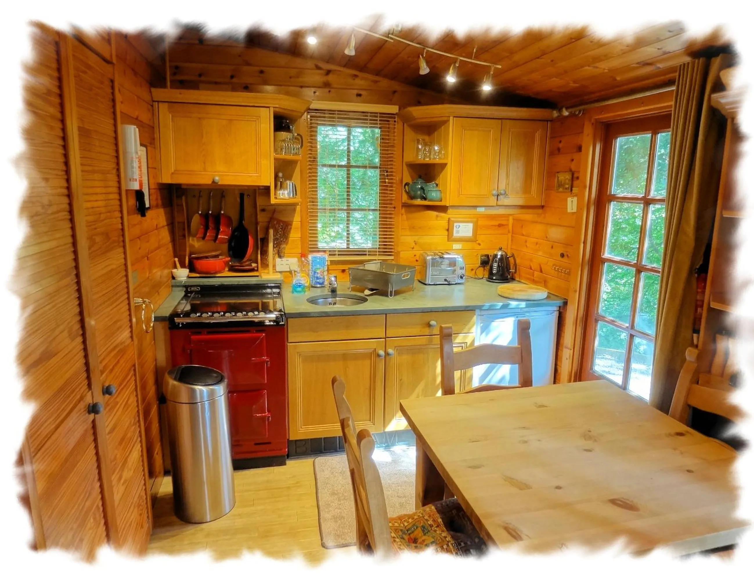 Kitchen or kitchenette in Blelham Tarn Rustic cabin in tranquil woodland