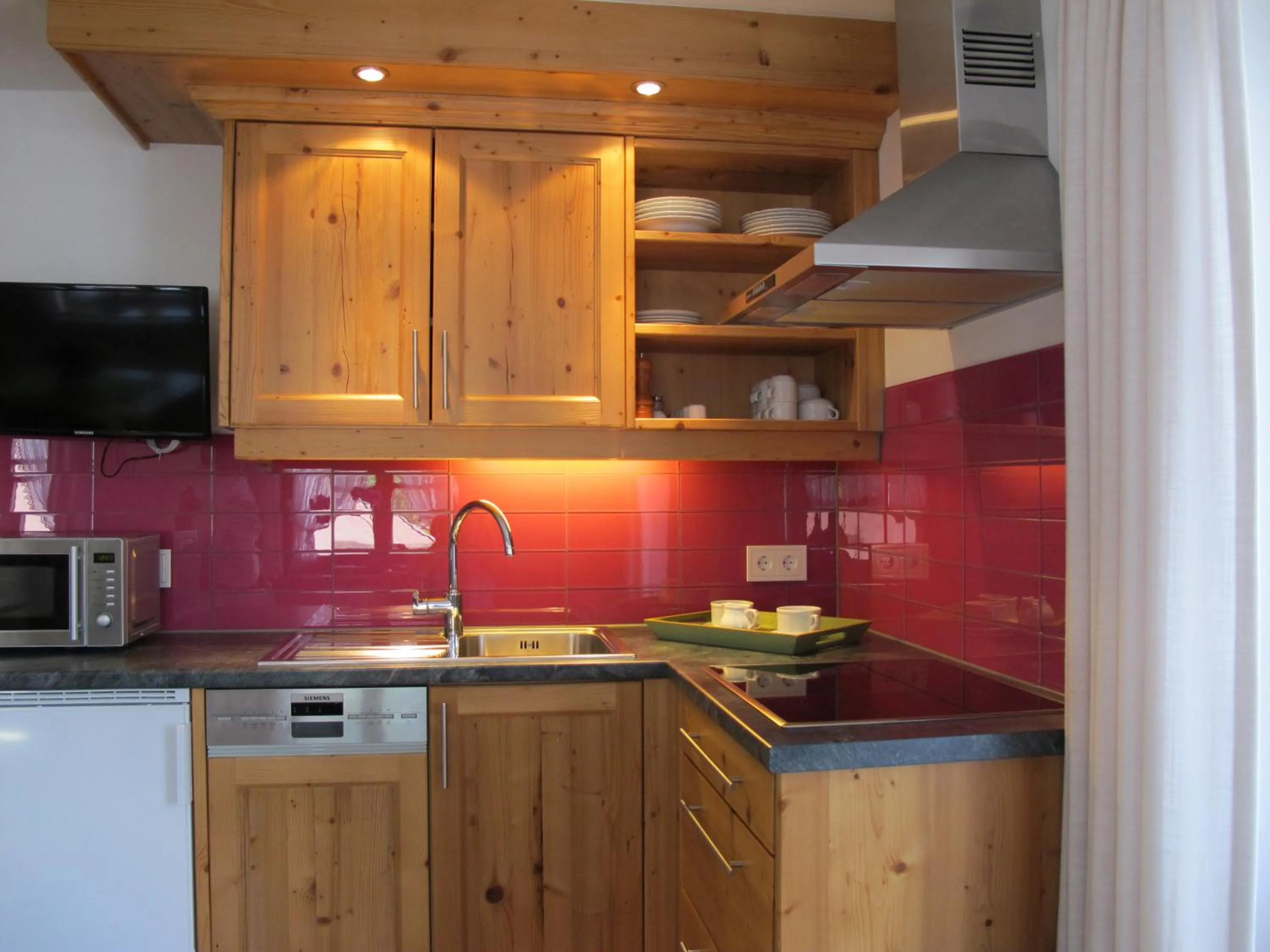 Kitchen or kitchenette in Gästehaus Bergstüberl