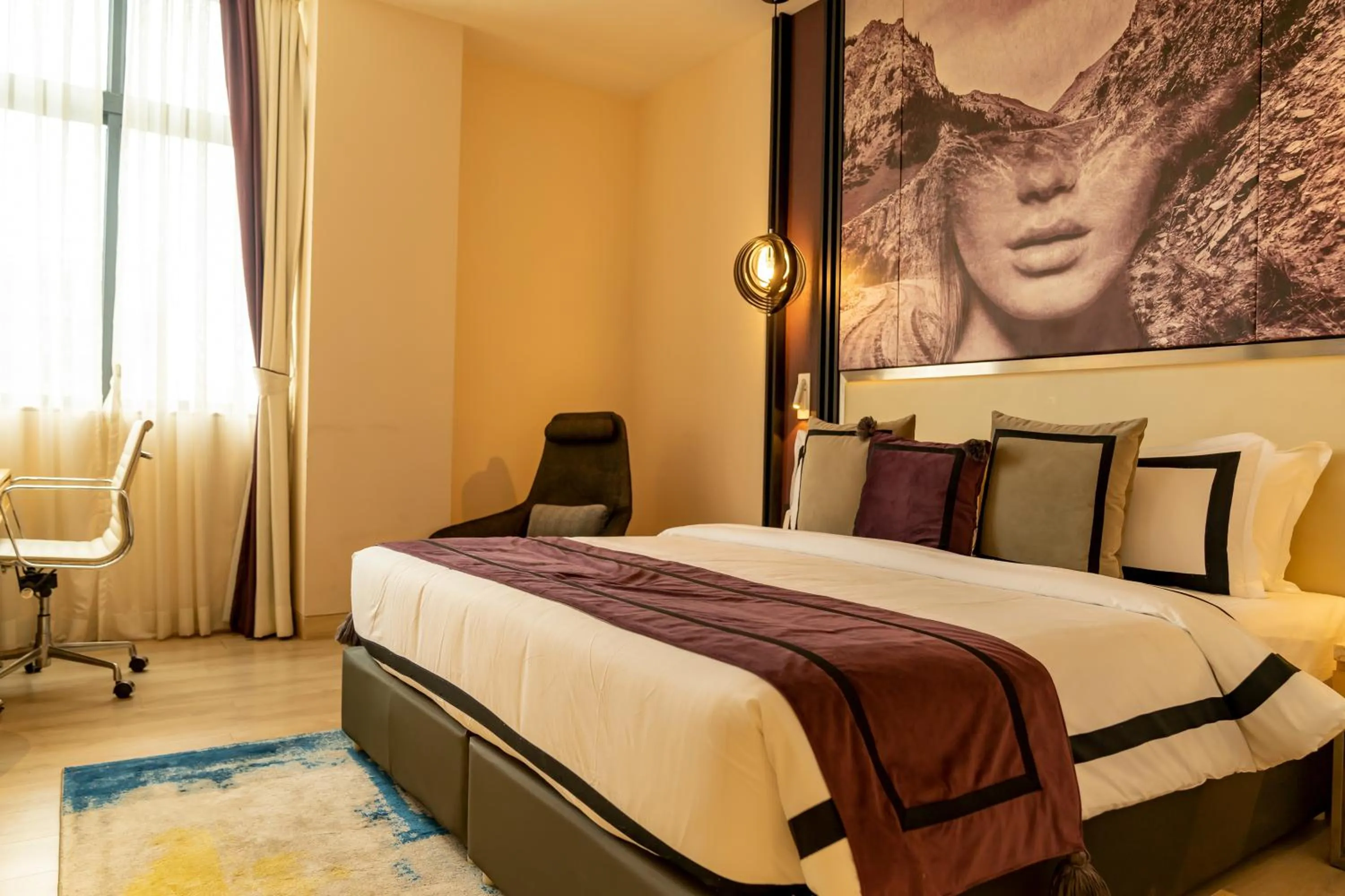 Bed in BEYZAA HOTEL AND SUITES