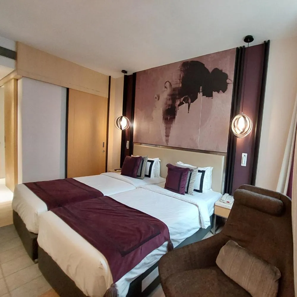 Bed in BEYZAA HOTEL AND SUITES
