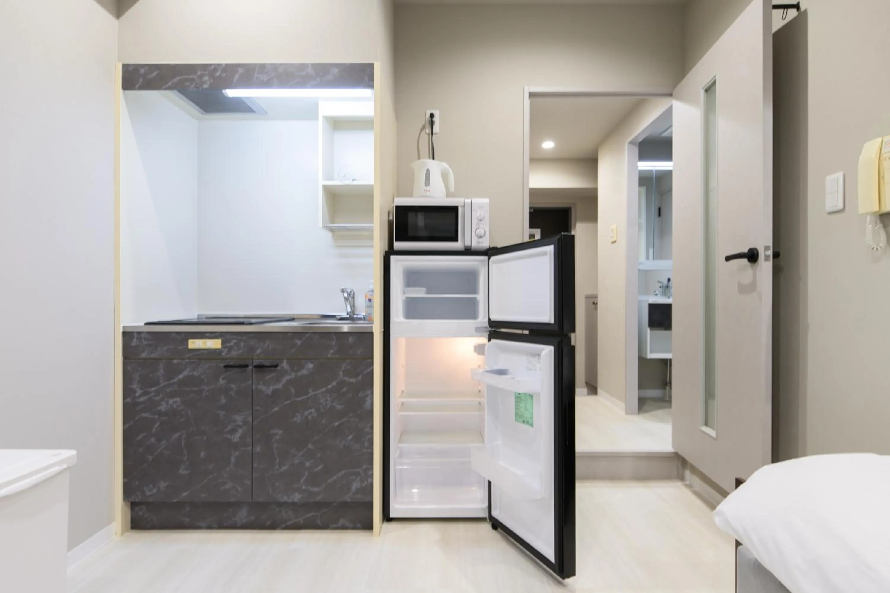 Kitchen or kitchenette in Ostay Kitahama Hotel Apartment