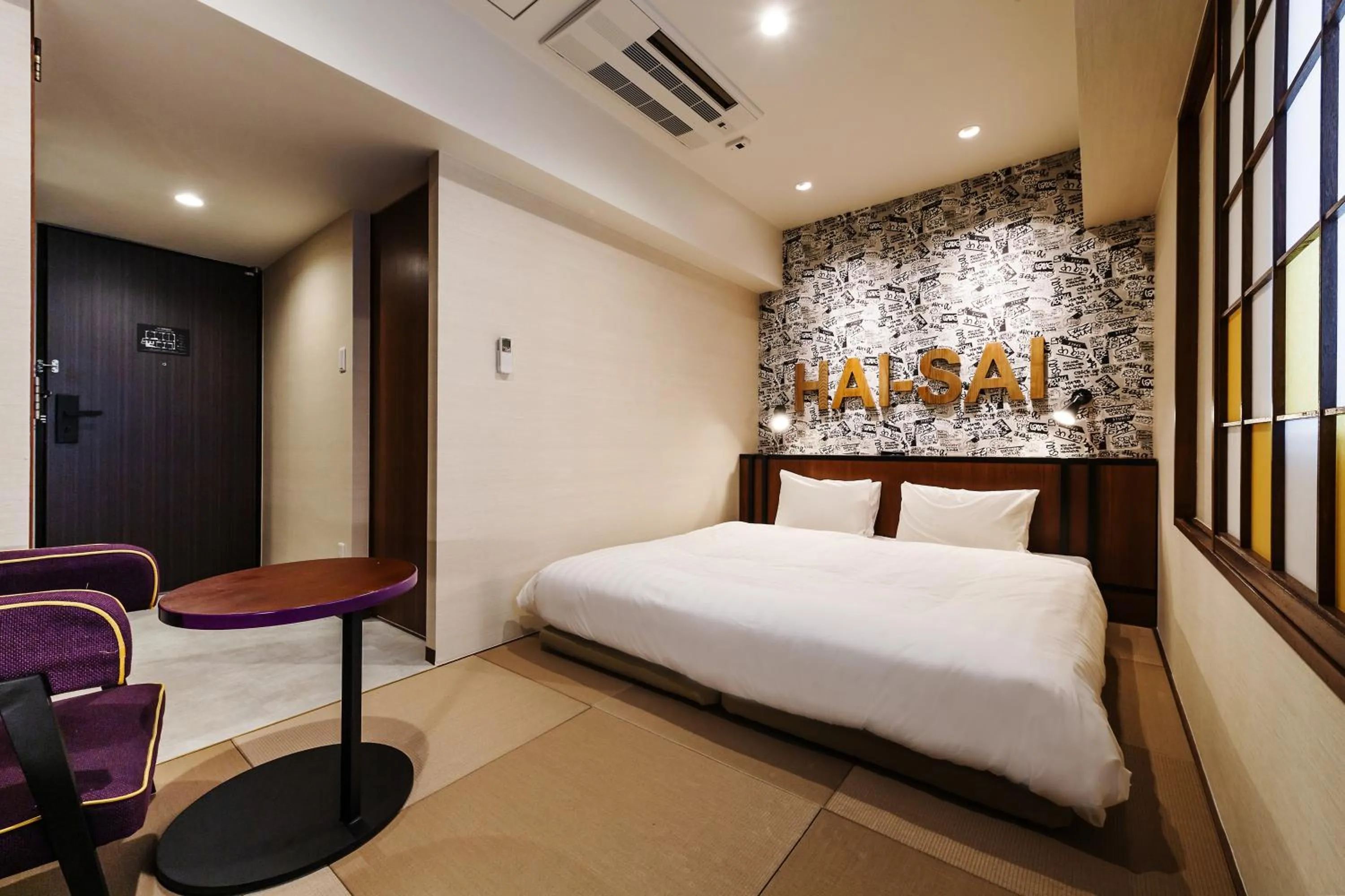 Bed in PROSTYLE RYOKAN Naha Kenchou Mae