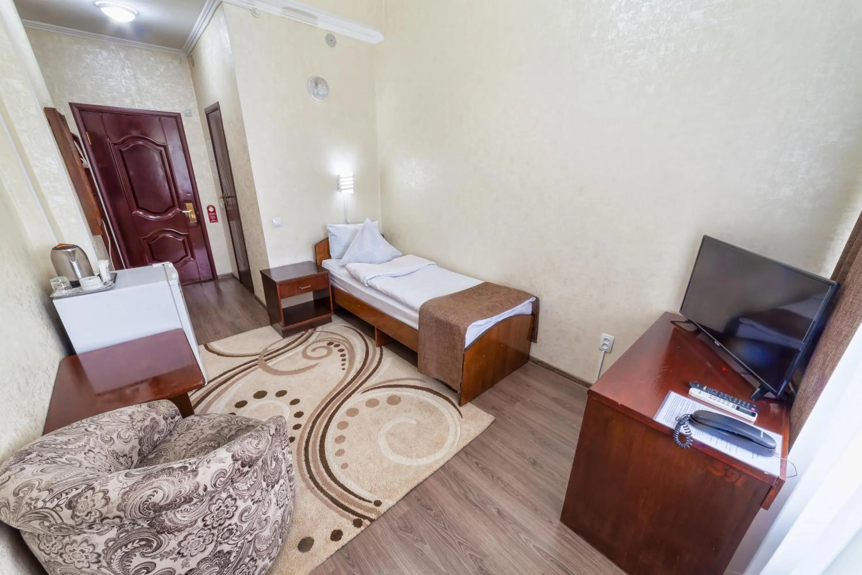 Bed in Hotel Osh-Nuru