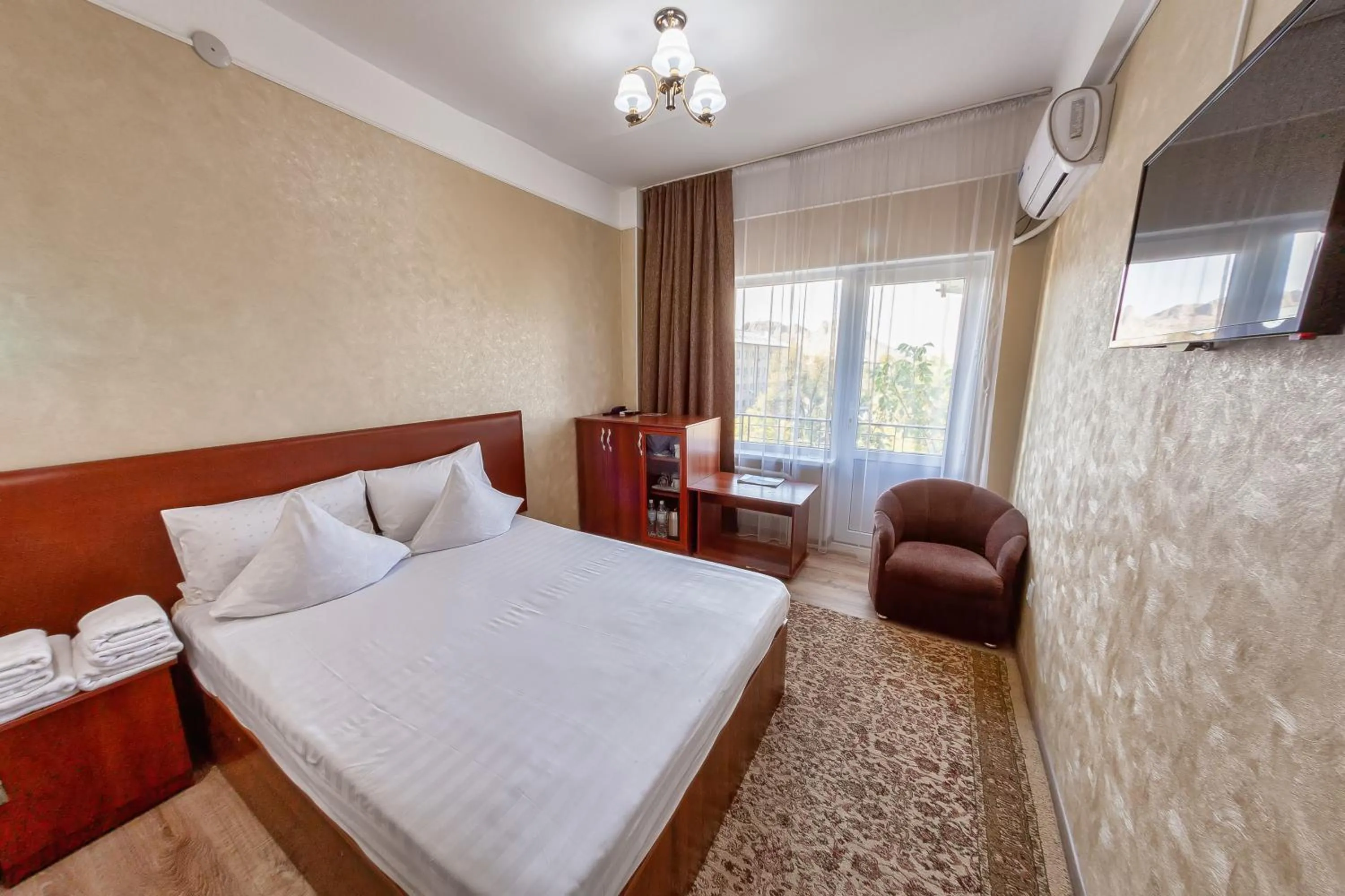 Bed in Hotel Osh-Nuru