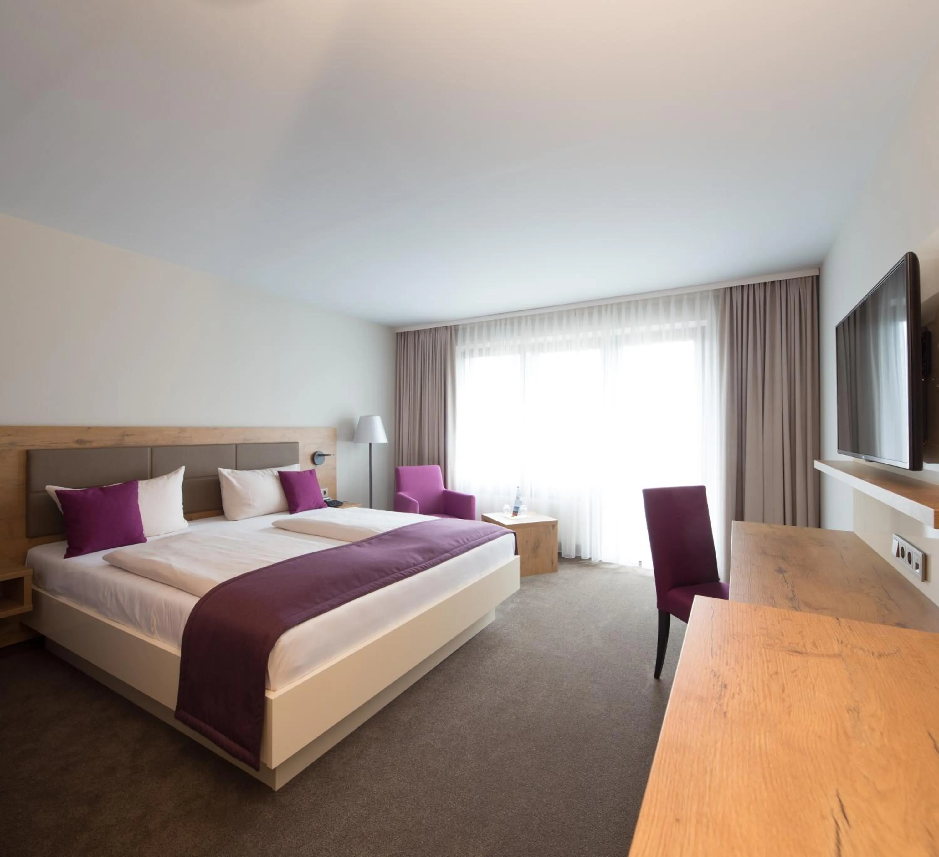 Bed in ARAMIS Tagungs- und Sporthotel