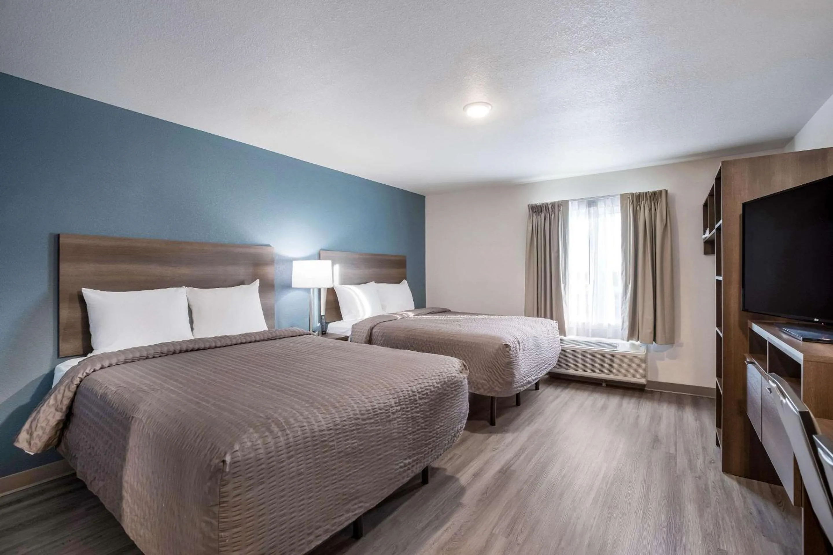 Bed in WoodSpring Suites Detroit Madison Heights