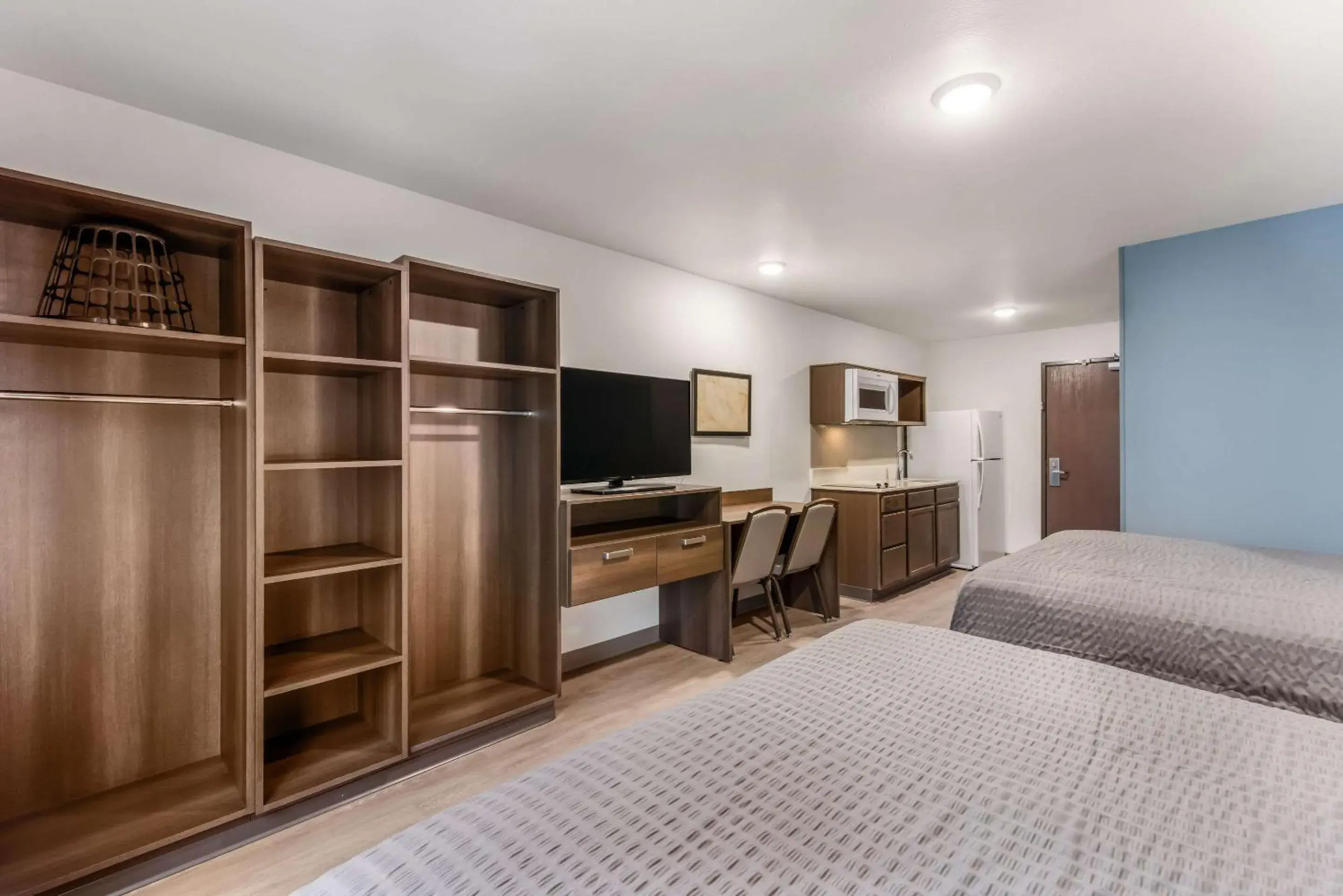 Bed in WoodSpring Suites Charlotte - University Research Park Bed in WoodSpring Suites Charlotte - University Research Park