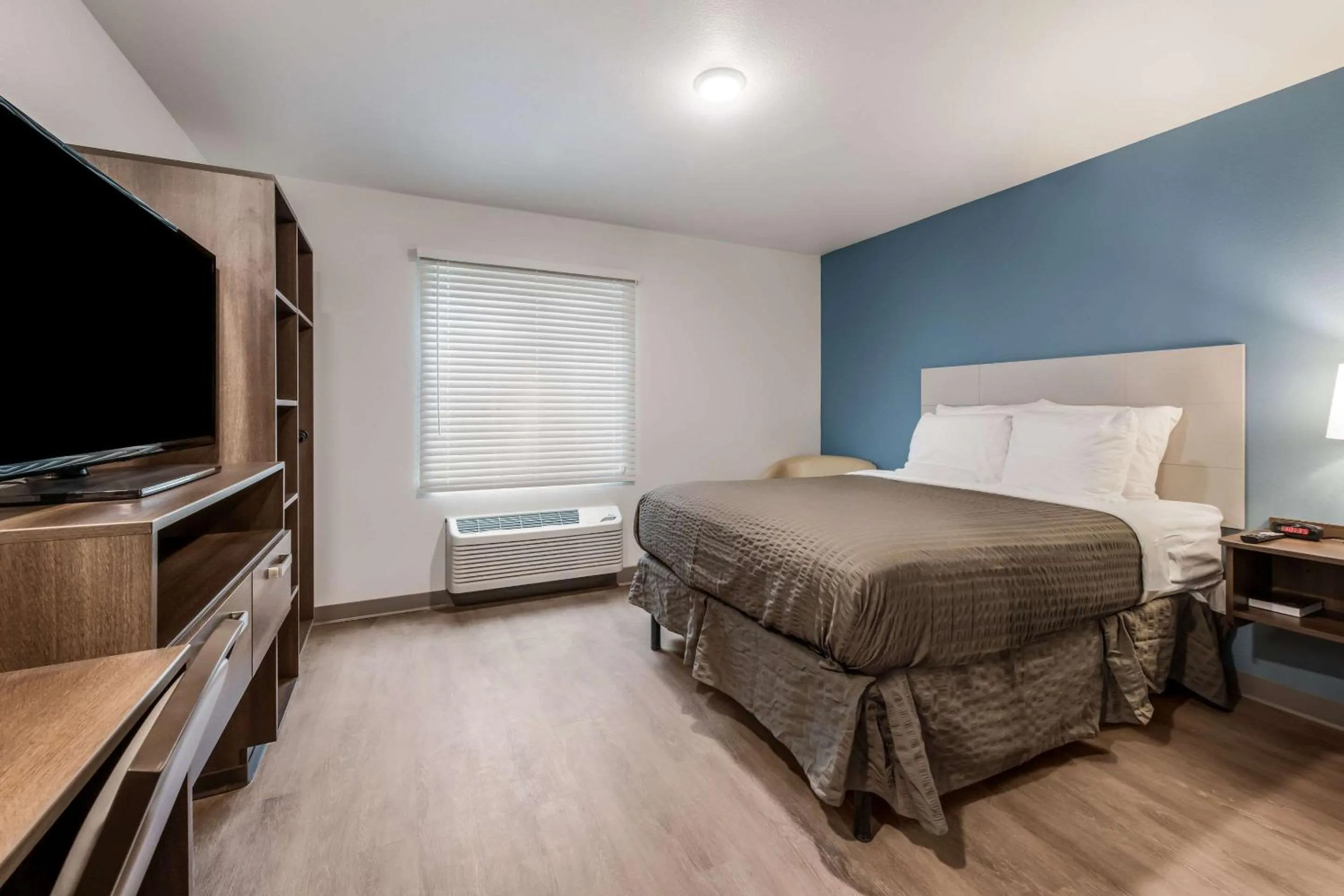 Photo of the whole room, Bed in WoodSpring Suites Charlotte - University Research Park