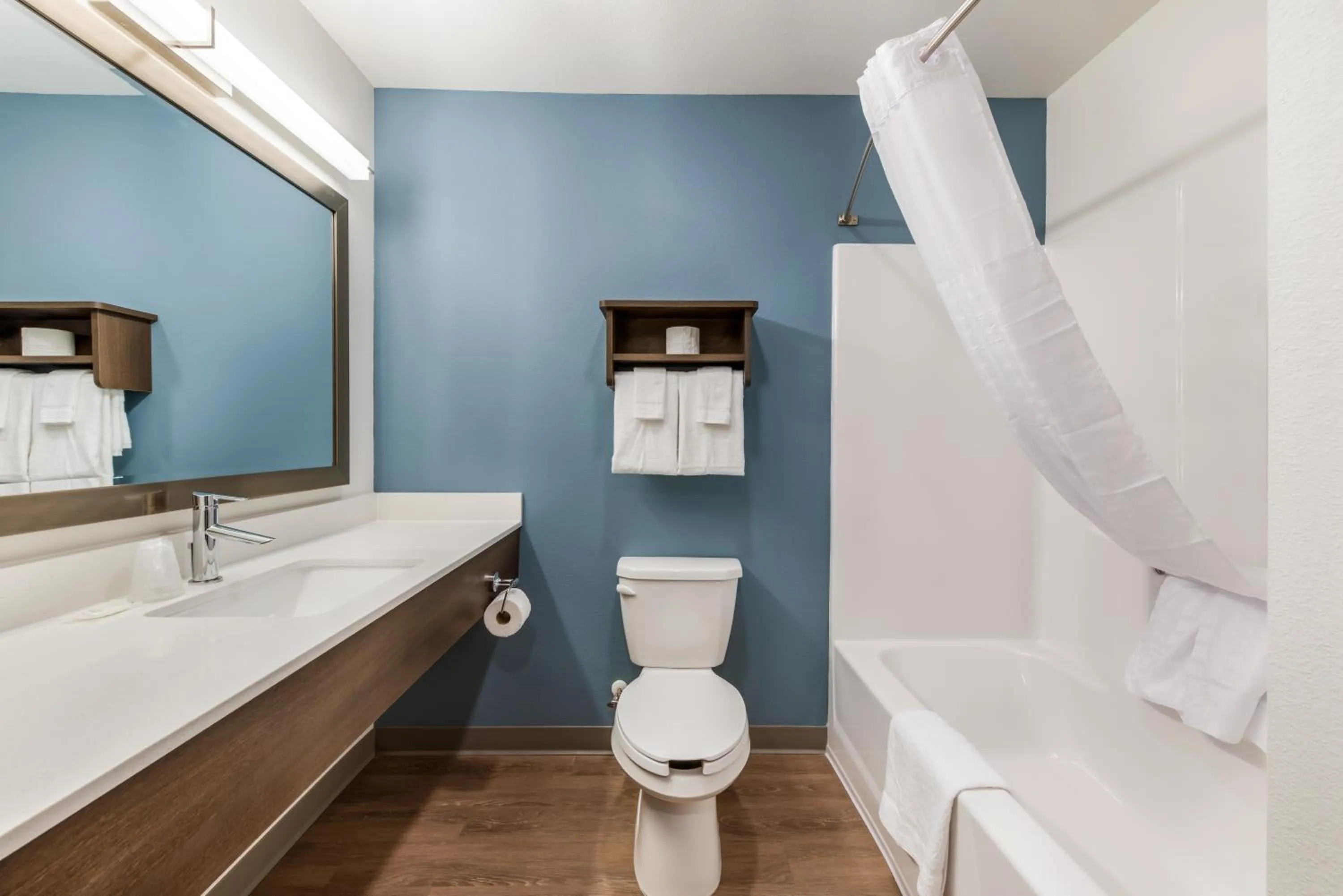 Bathroom in WoodSpring Suites Charlotte - University Research Park