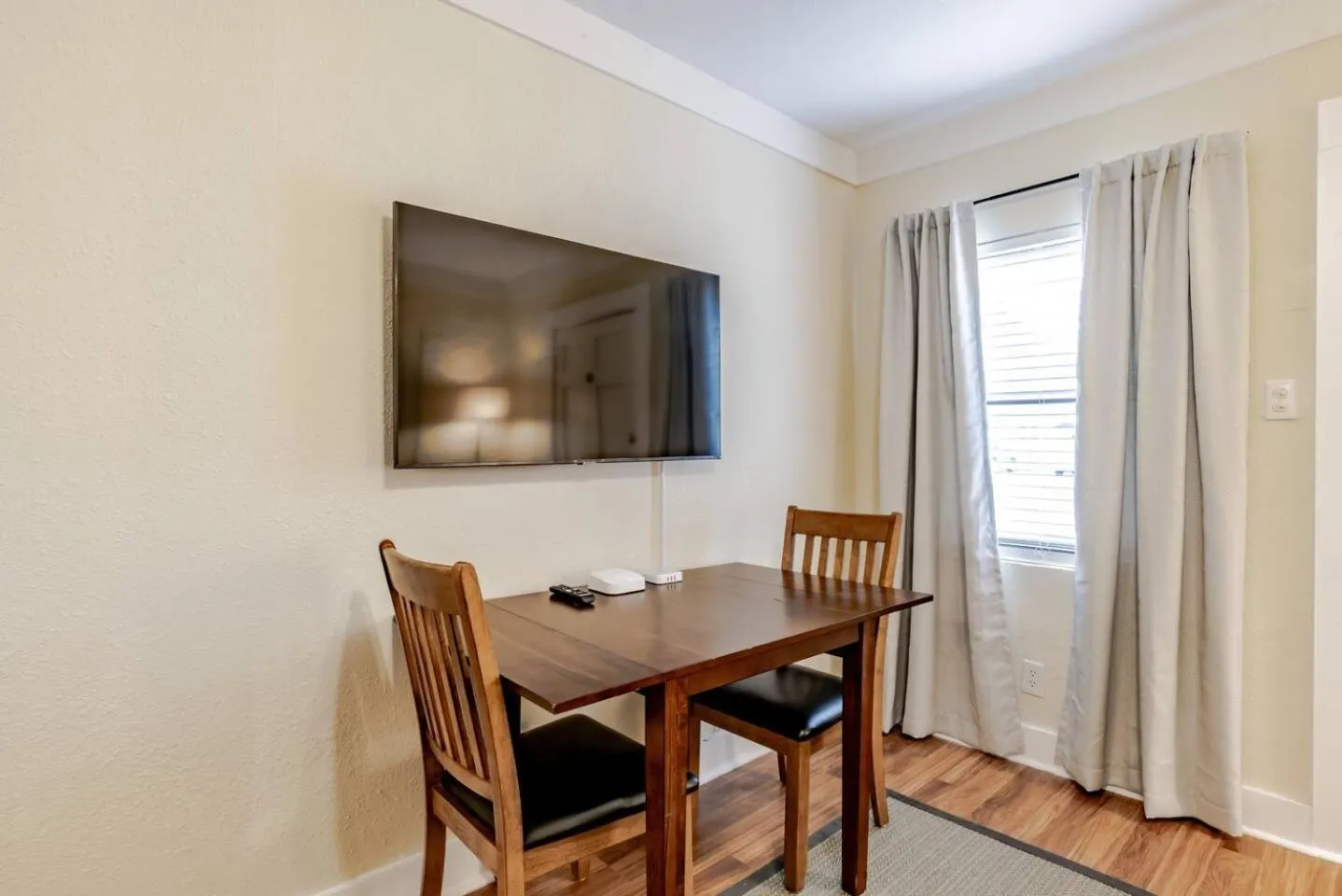 TV and multimedia in The Flats on Florida St - Super Comfy 2-Bedroom Apartments