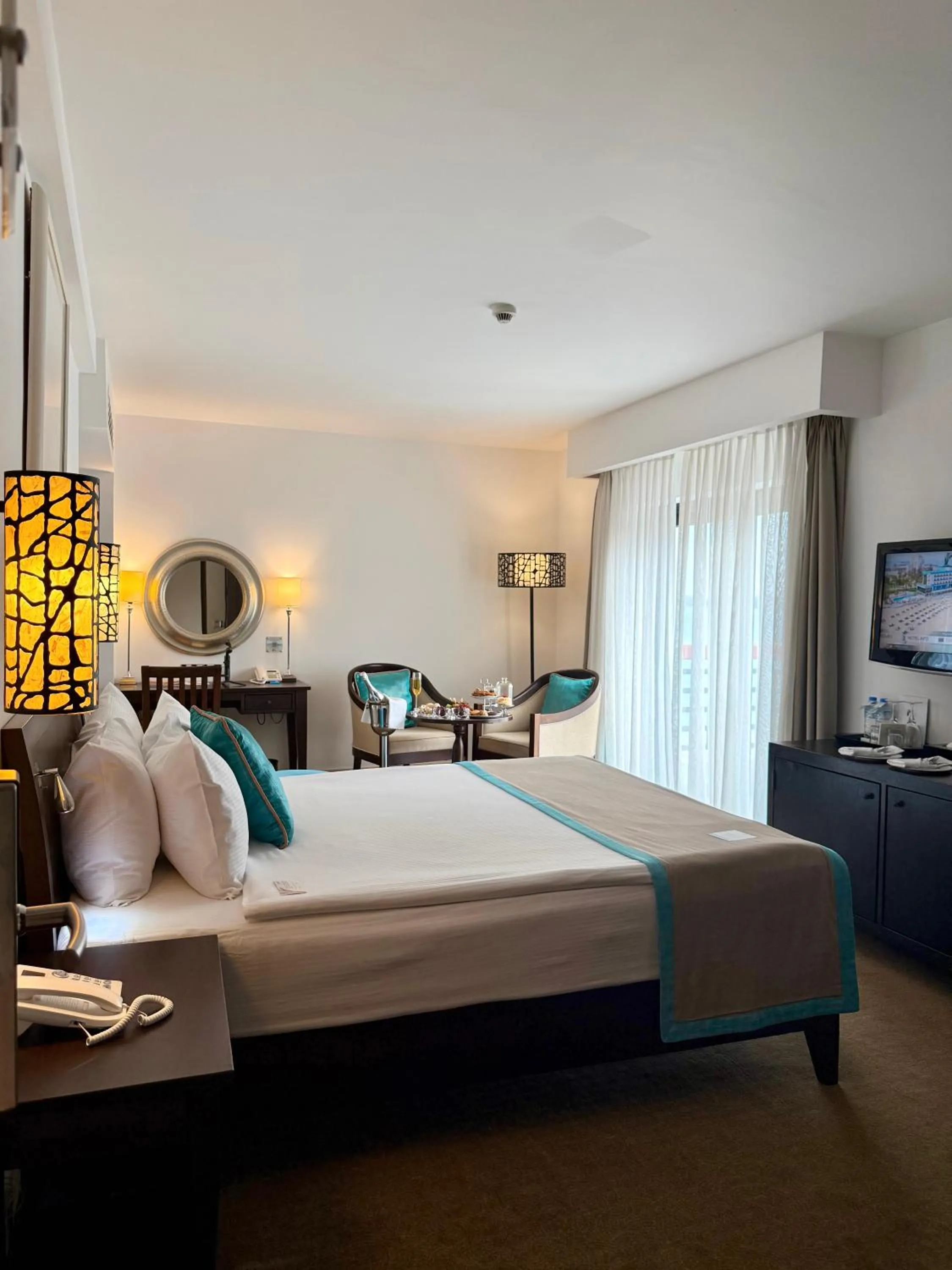 Seating area, Bed in Arkin Palm Beach Hotel