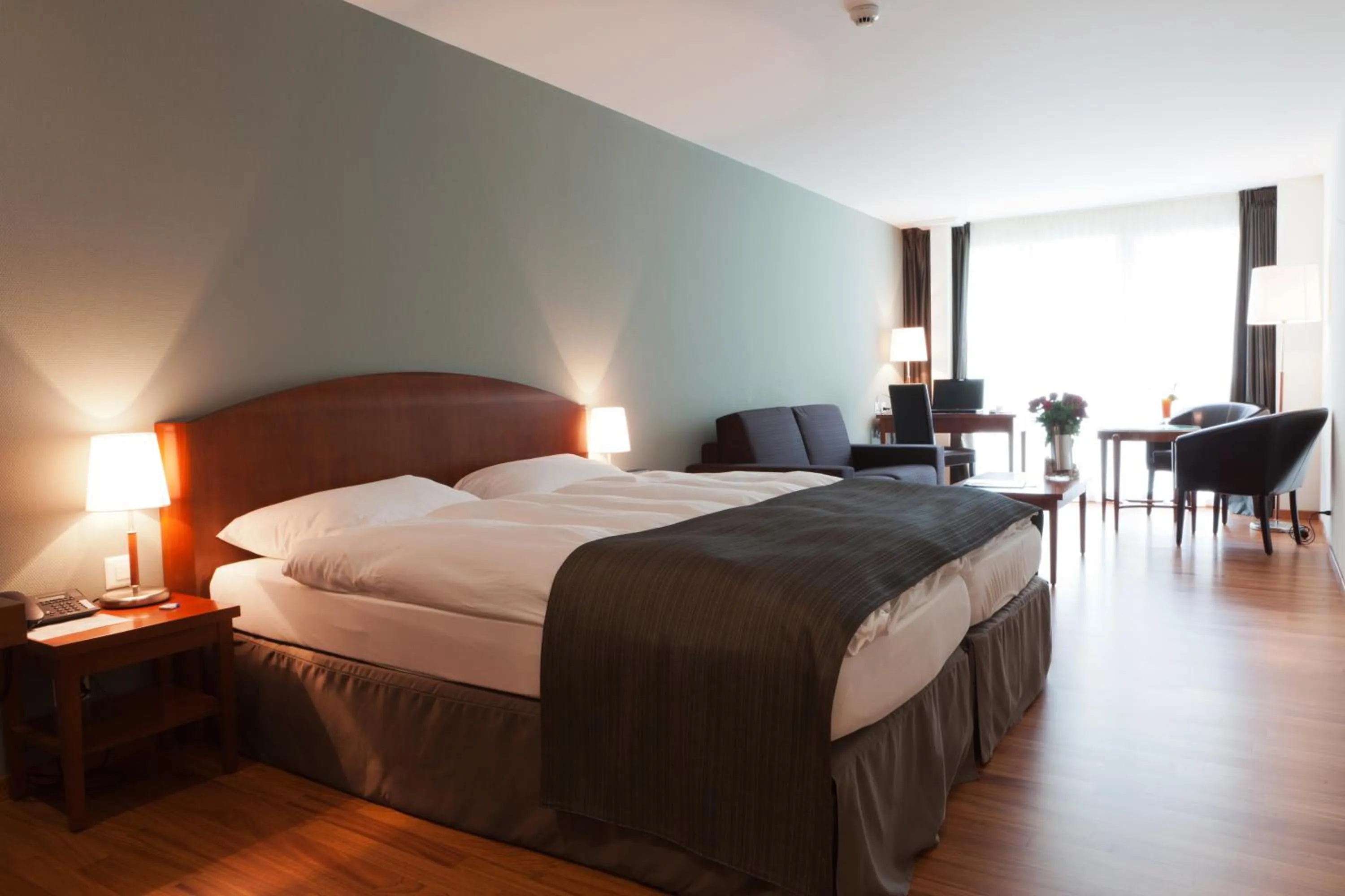 Bedroom, Bed in Hôtel Rallye & Entrées aux Bains de la Gruyère