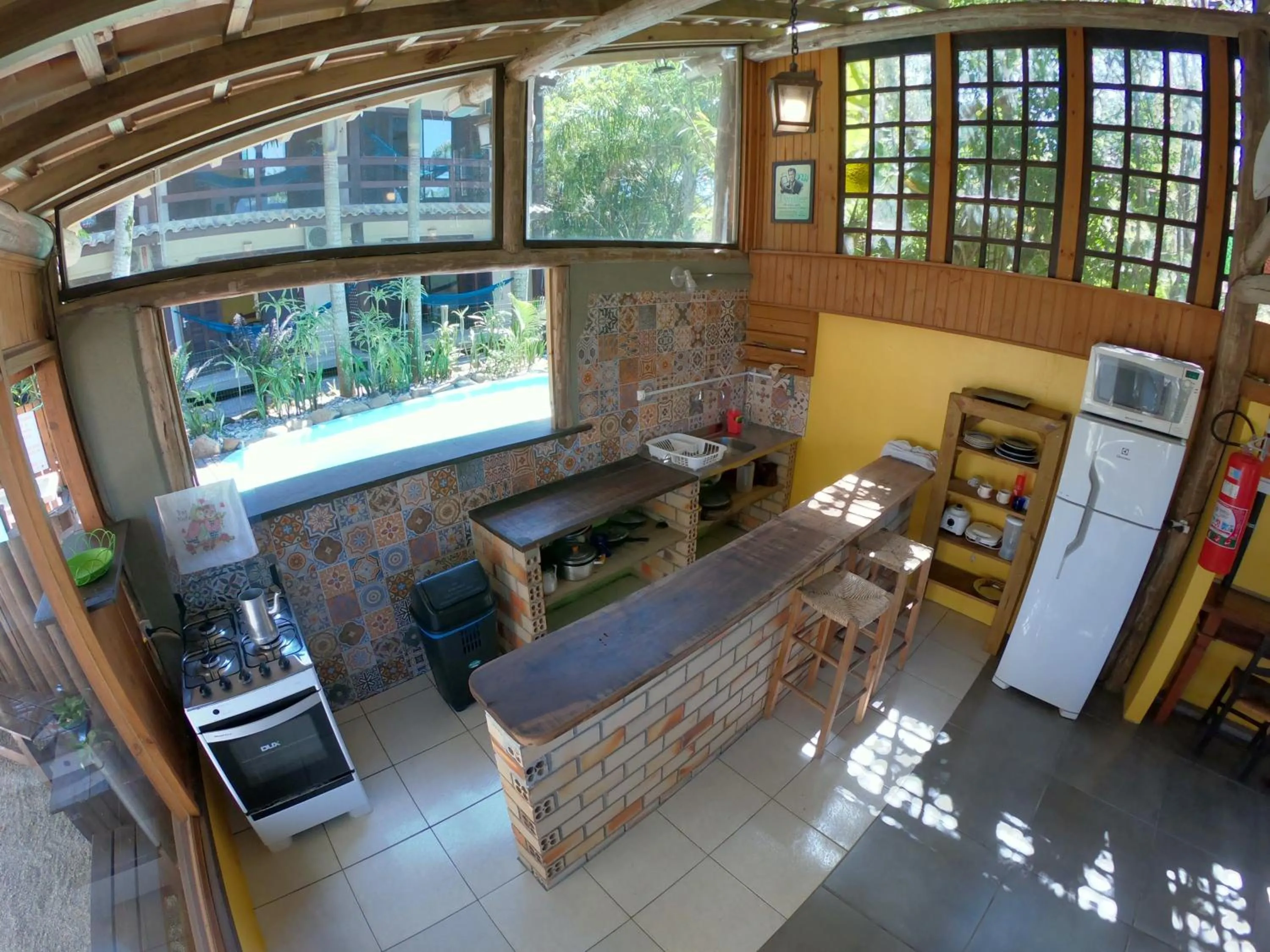 Dining area in Pousada El Pátio da Ferrugem uma quadra da praia