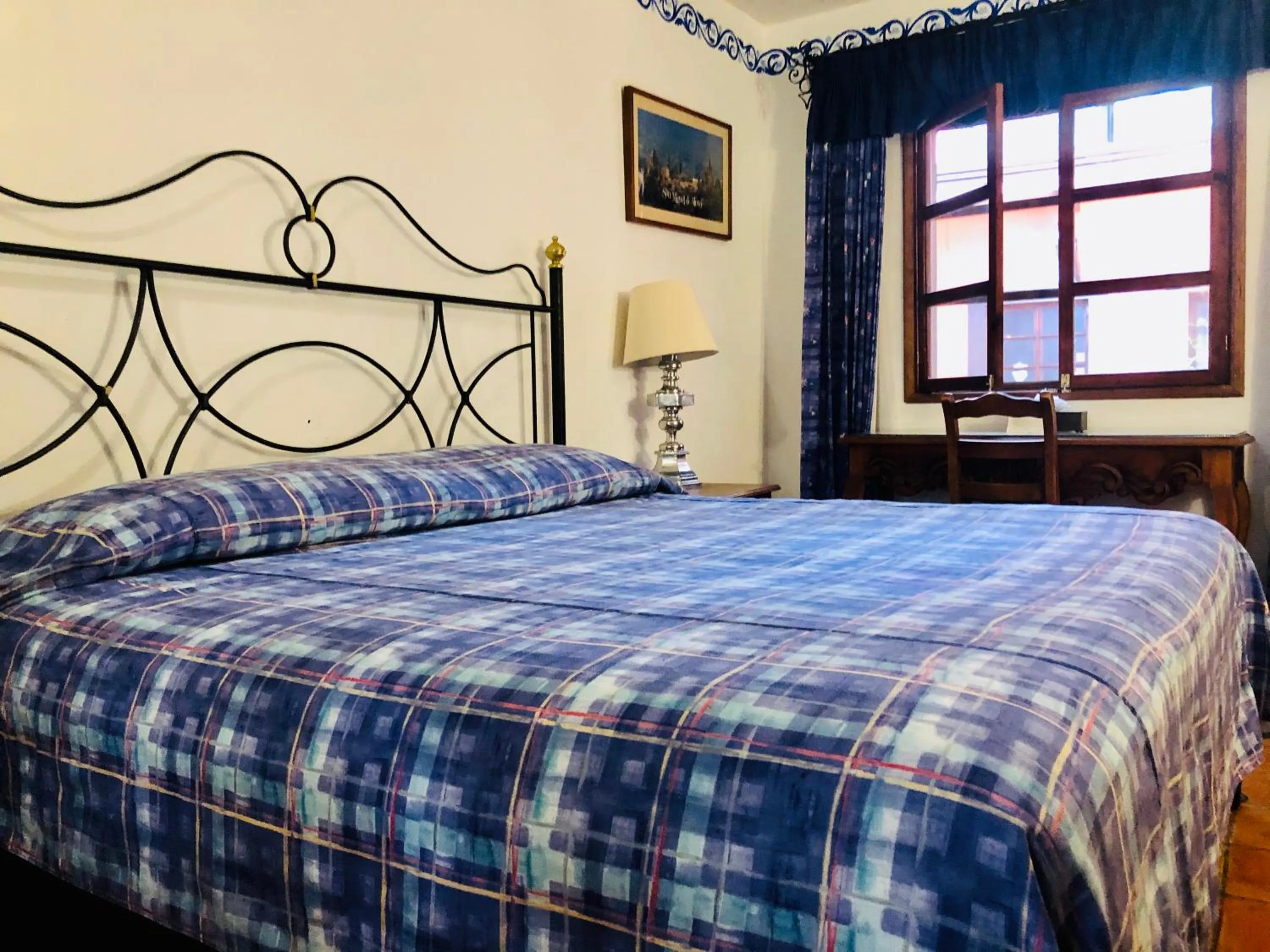 Bed in Hotel Mansión Virreyes by Rotamundos