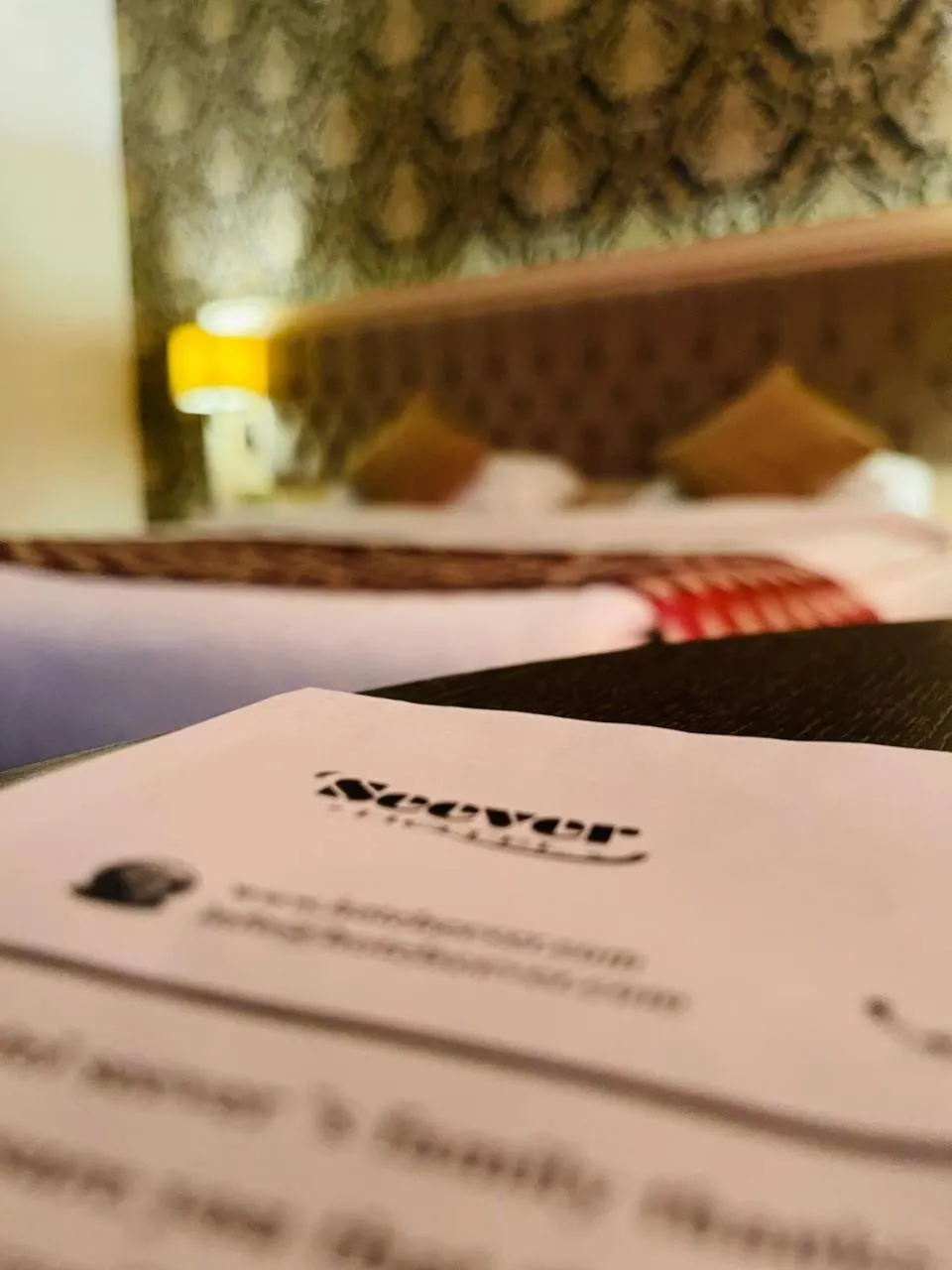 Text overlay, Bed in Hotel Seever