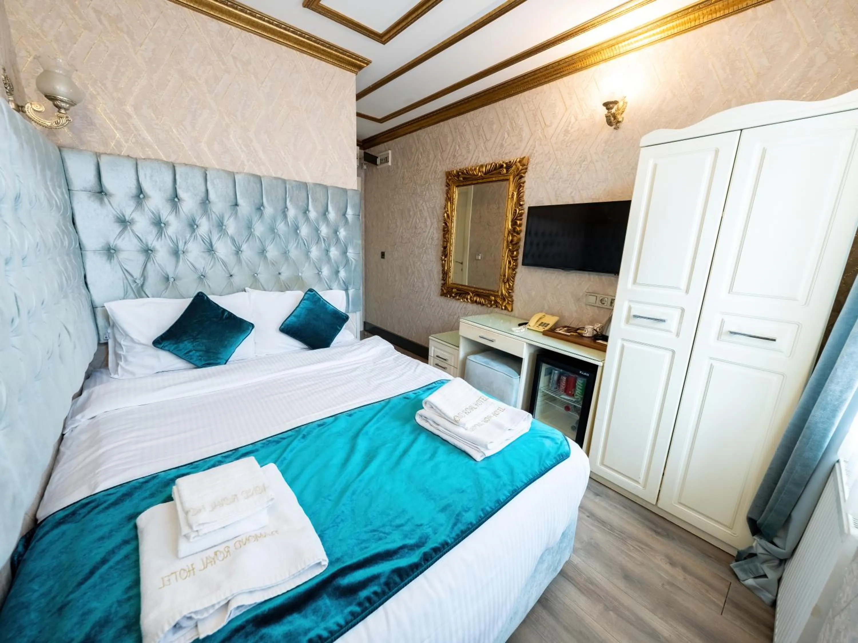 Bed in Diamond Royal Hotel