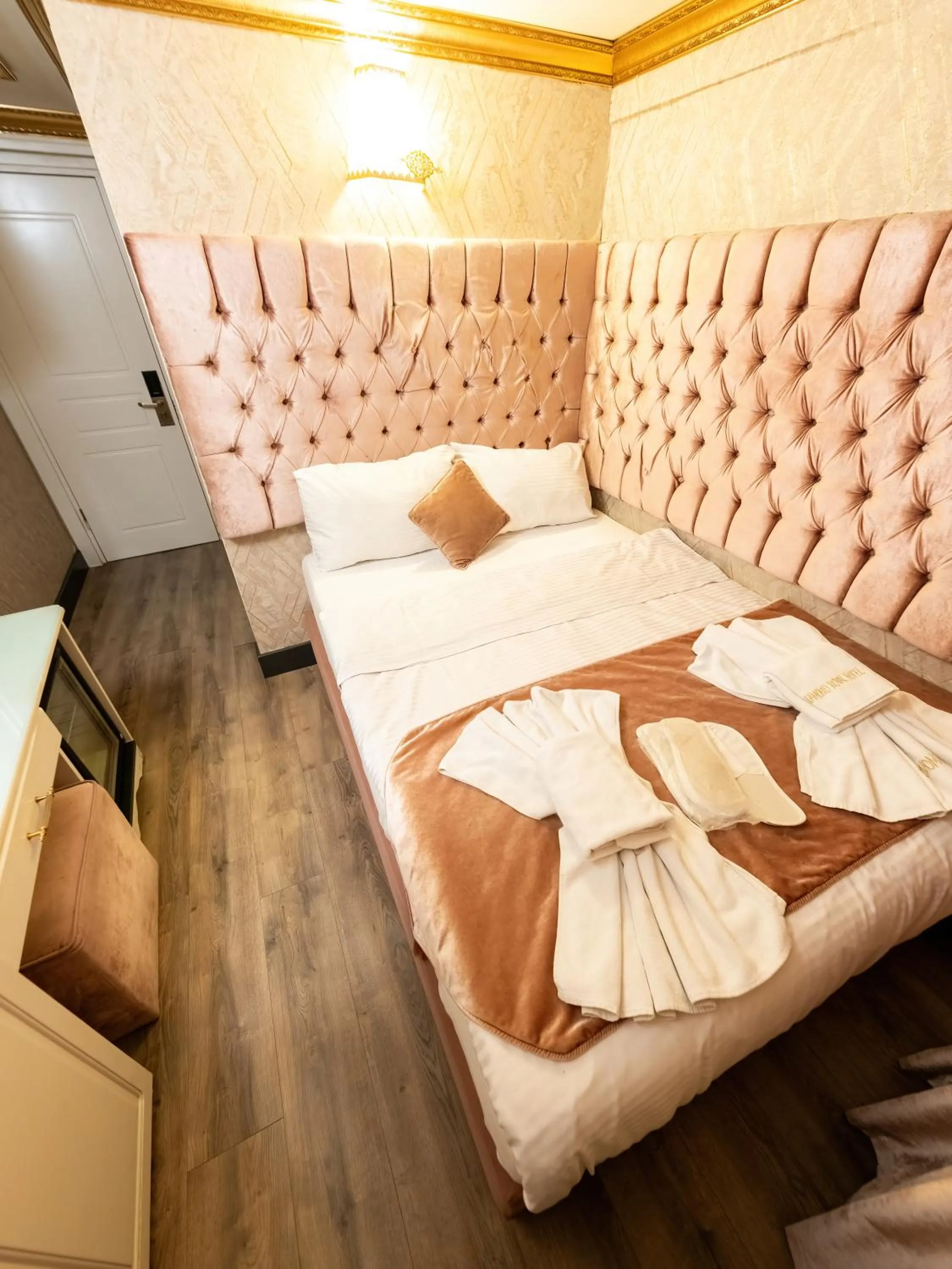 Bed in Diamond Royal Hotel