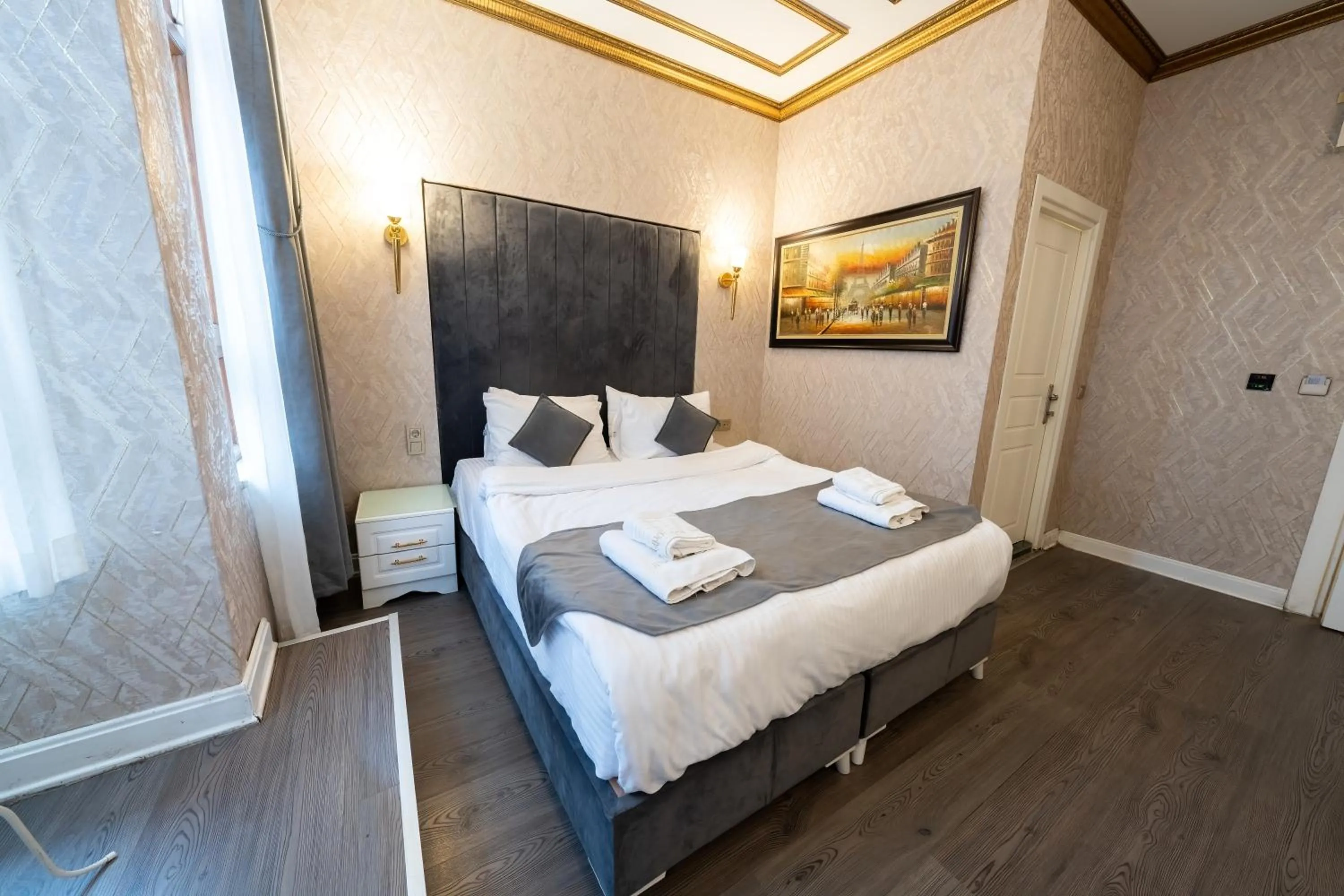 Bed in Diamond Royal Hotel