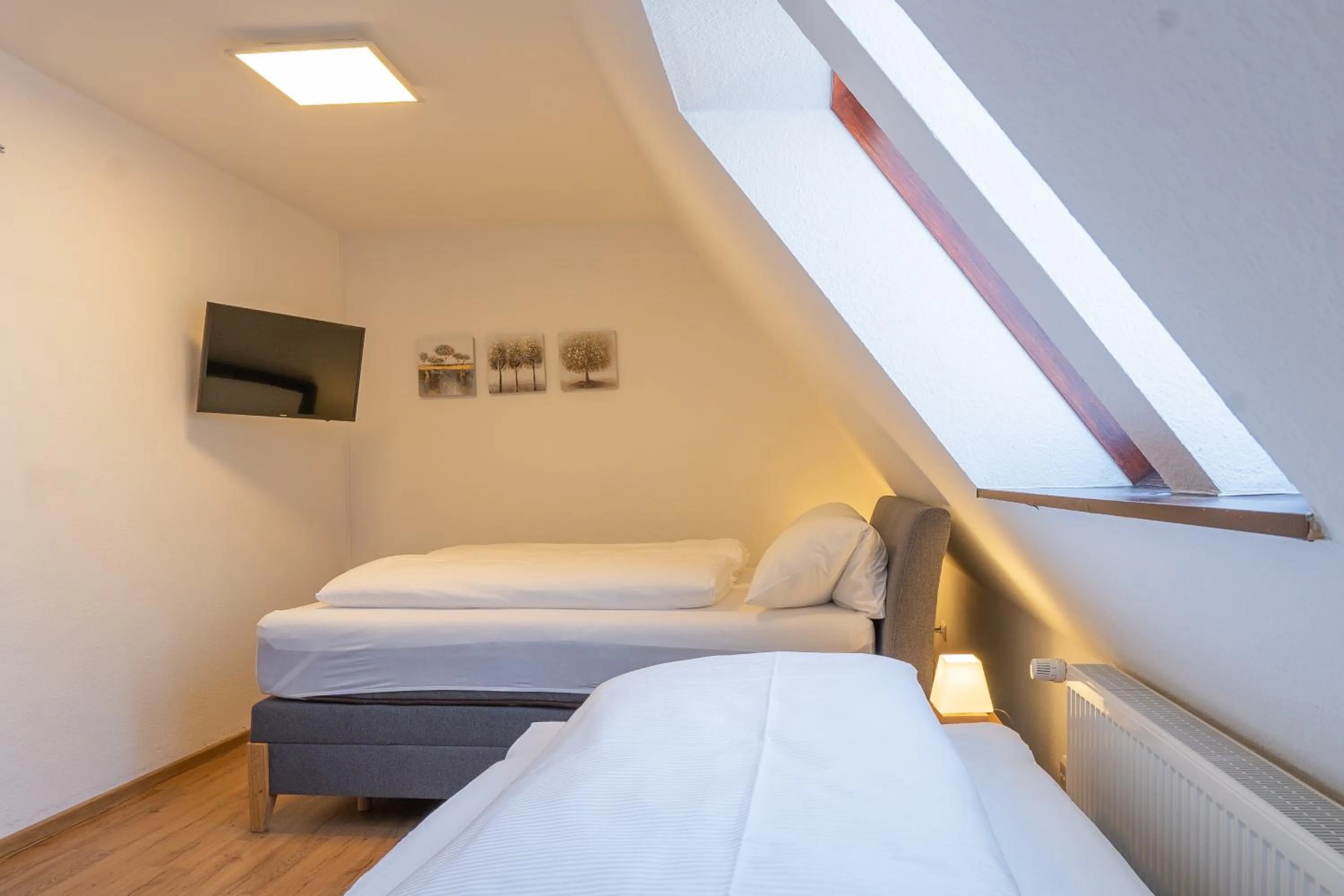 Photo of the whole room, Bed in Hotel Dortmunder Hof