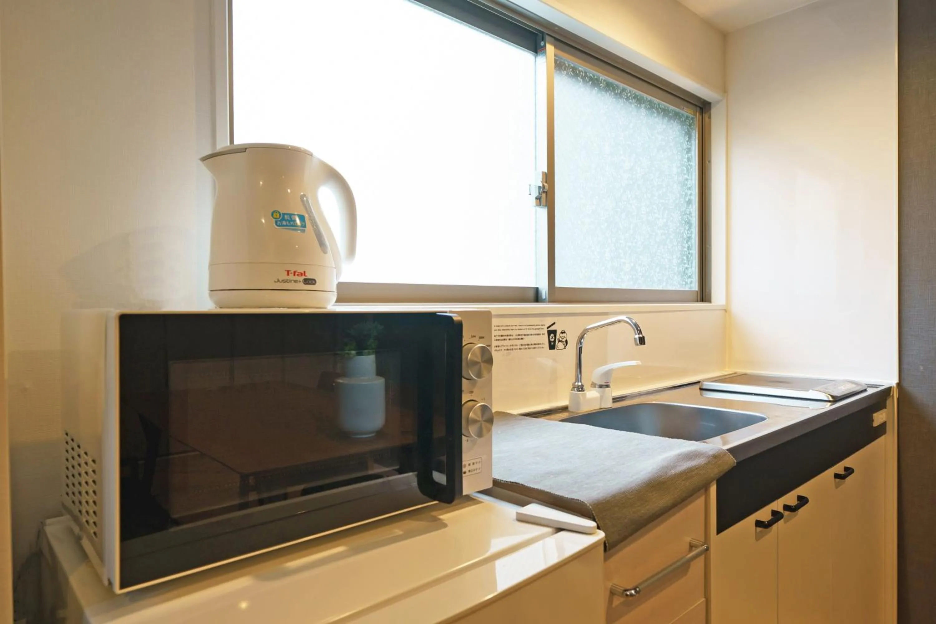 Kitchen or kitchenette in Gracia Hotel