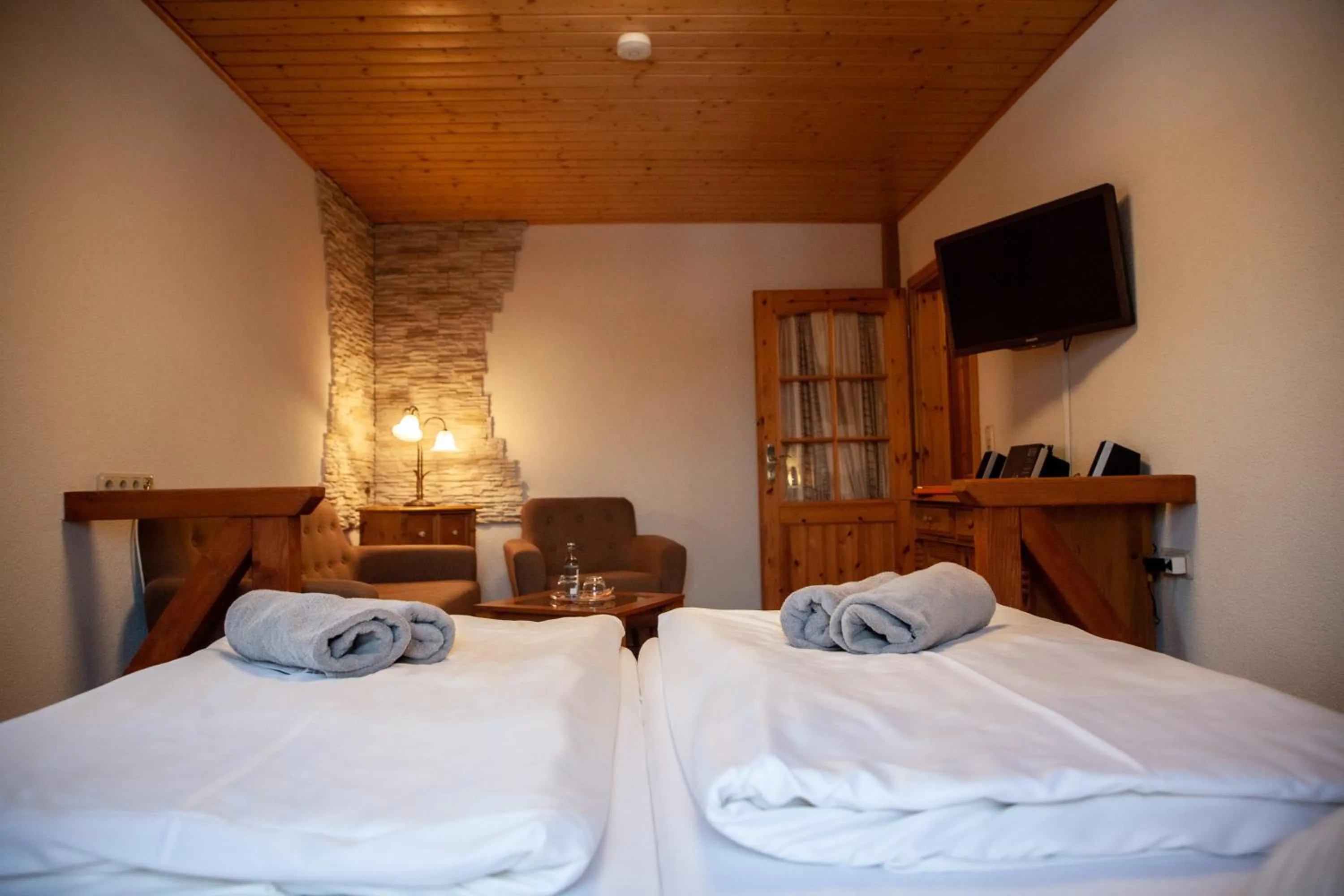 Living room, Bed in Naturhotel Gasthof Bärenfels