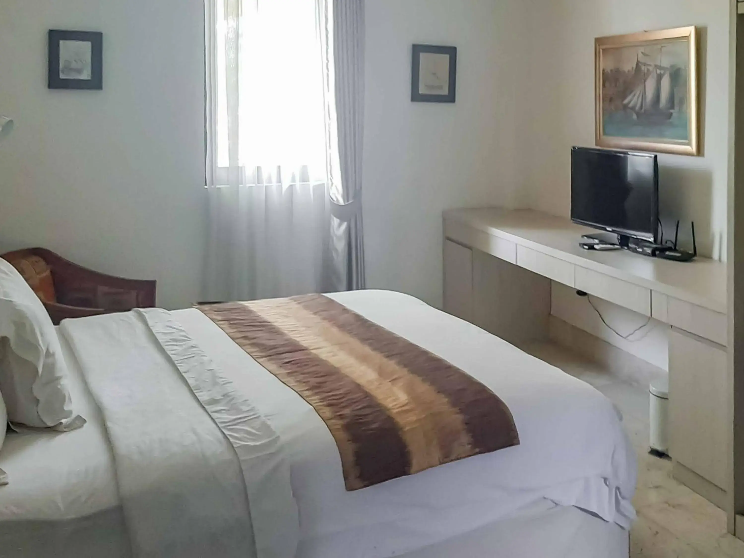 Bed in Bangka Suite Mitra RedDoorz Bed in Bangka Suite Mitra RedDoorz