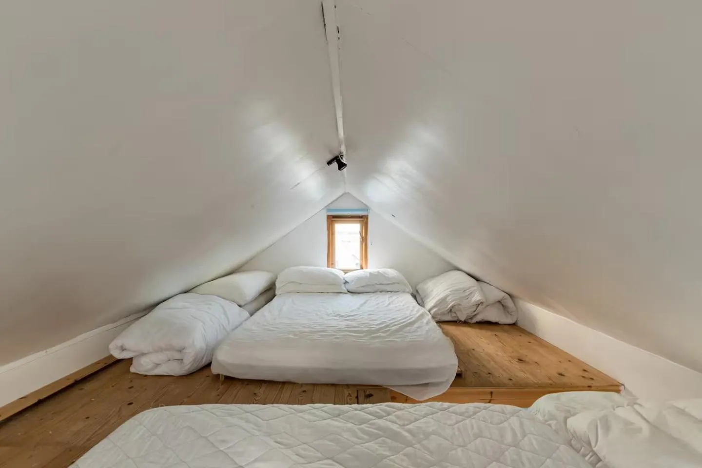Bed in Stargazing Beach Hut on Mudeford Sandbank with wake up sea views