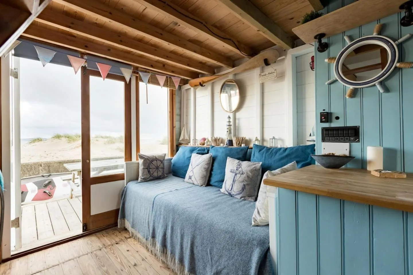 Seating area in Stargazing Beach Hut on Mudeford Sandbank with wake up sea views