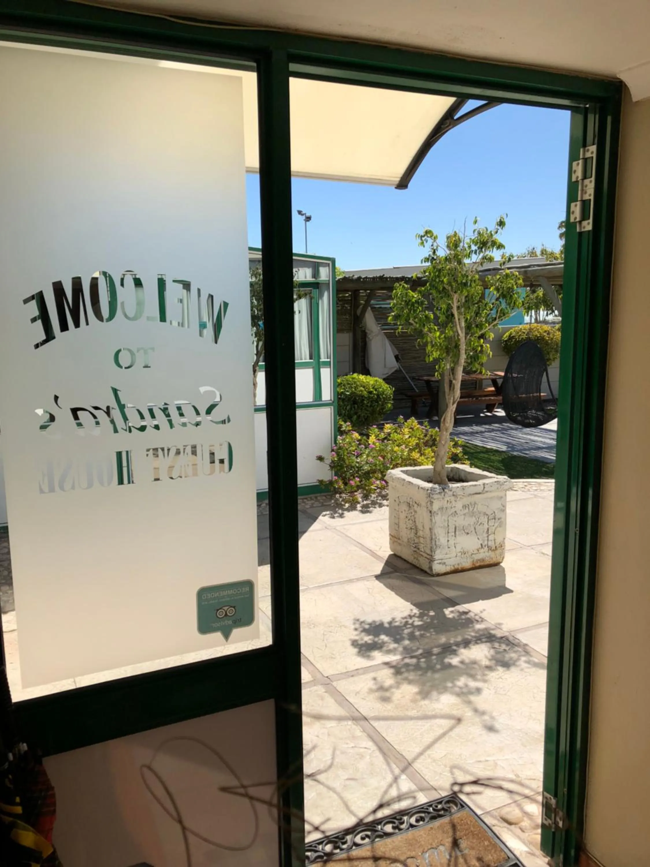 Property logo or sign in Sandra's Guest House