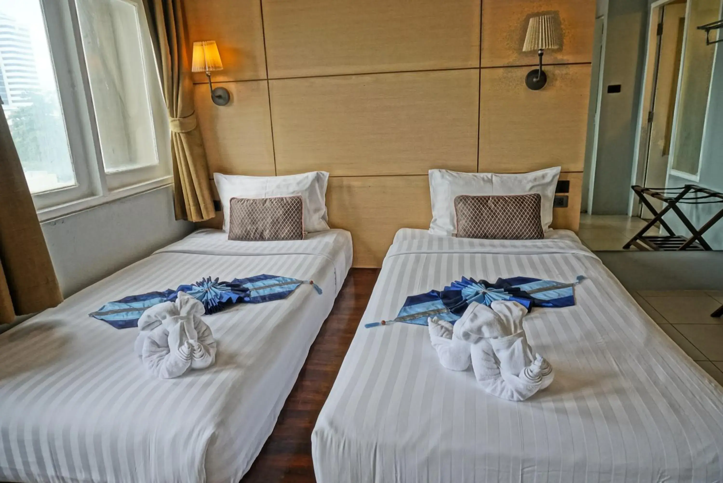 Bed in Montree Phuket Hotel Bed in Montree Phuket Hotel