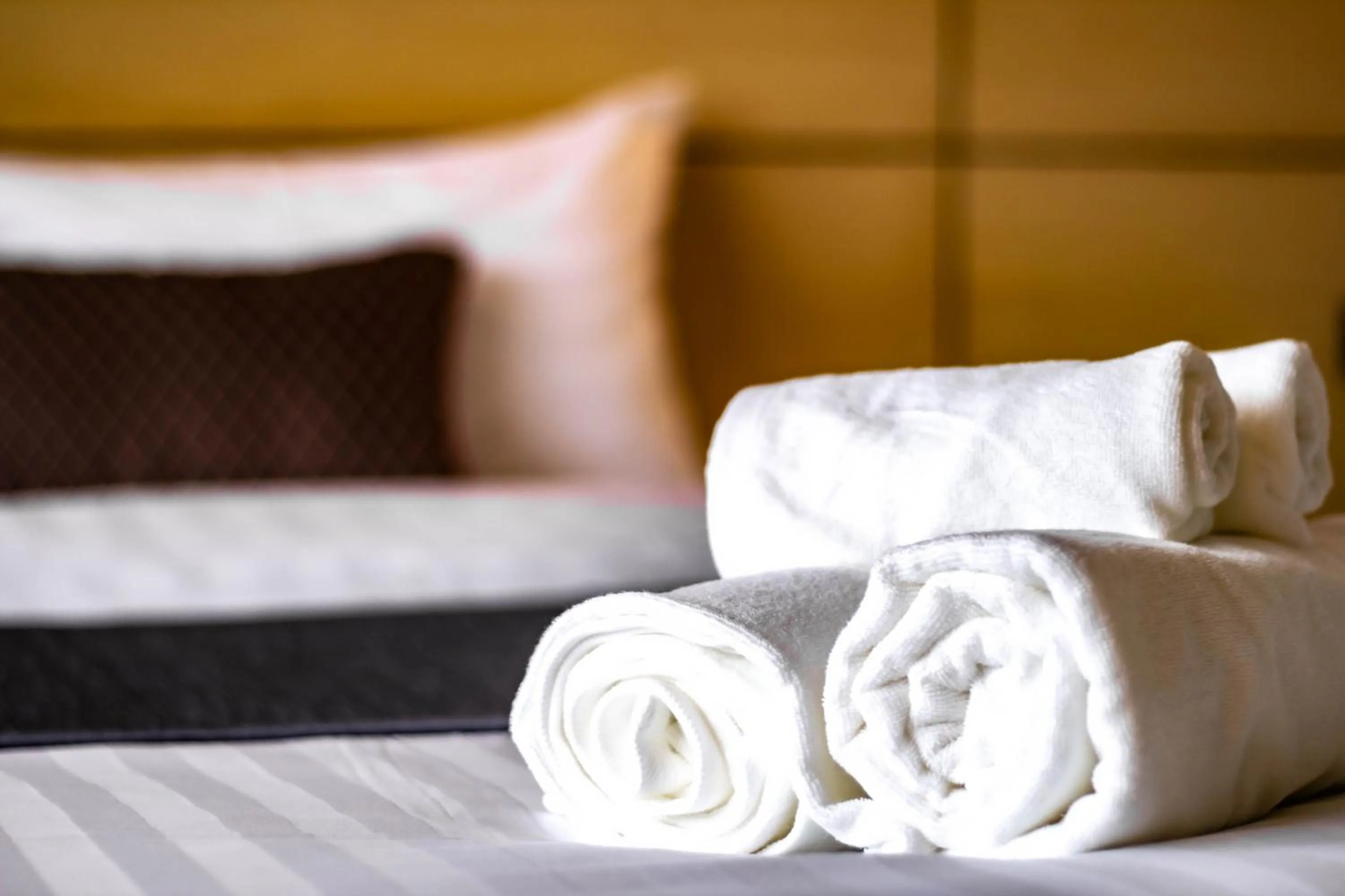 towels, Bed in Montree Phuket Hotel