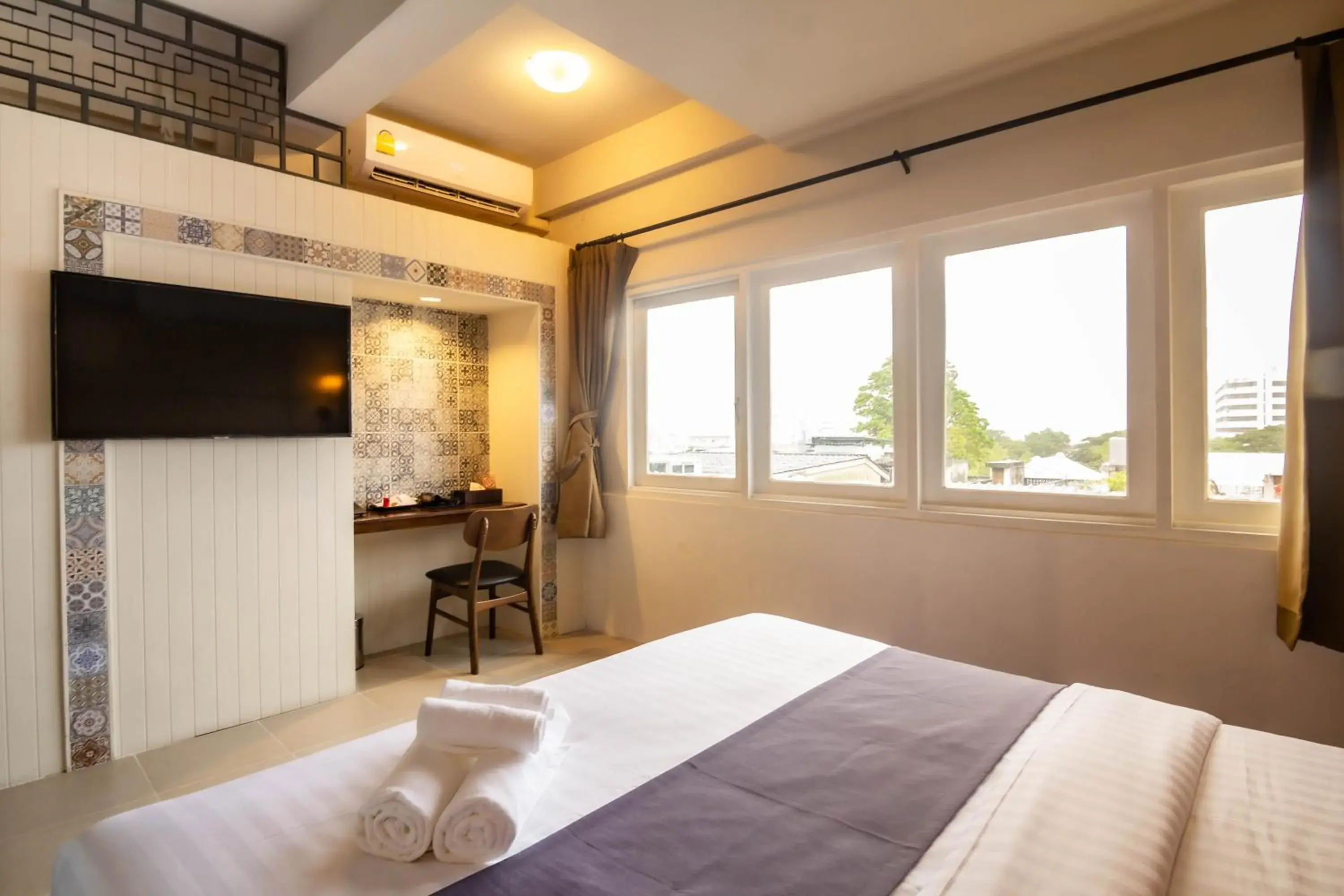 Bed in Montree Phuket Hotel Bed in Montree Phuket Hotel