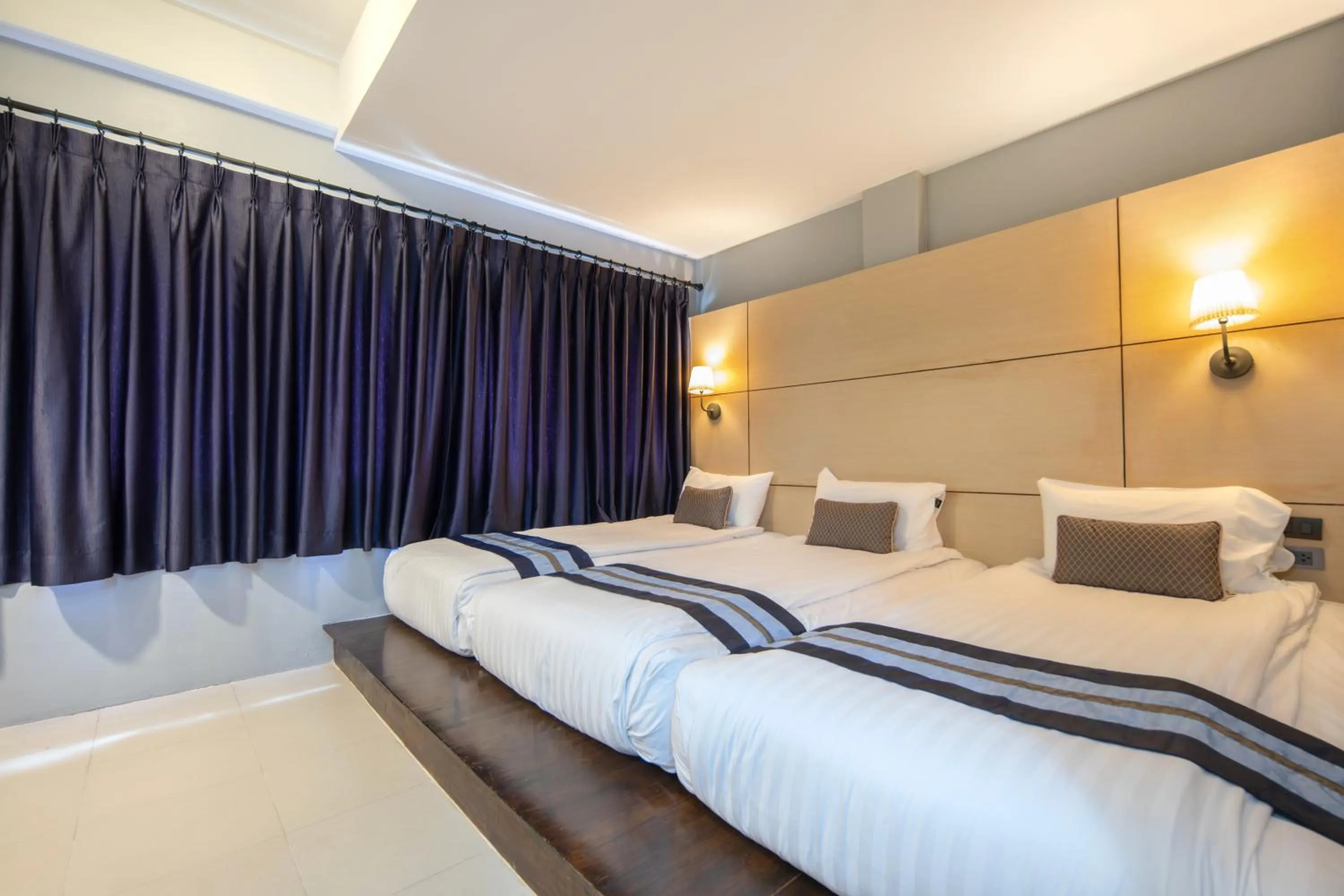 Bed in Montree Phuket Hotel