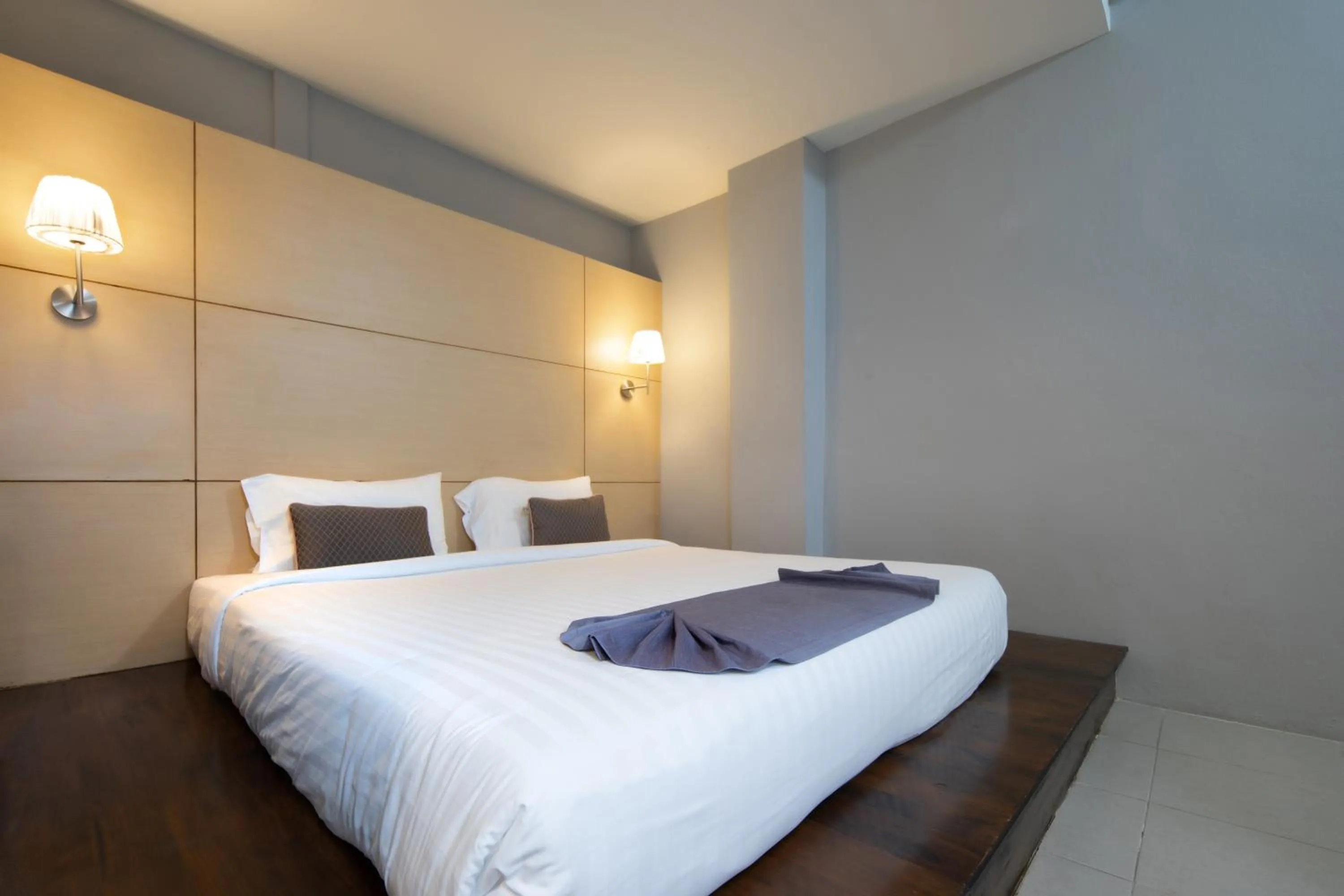 Bed in Montree Phuket Hotel