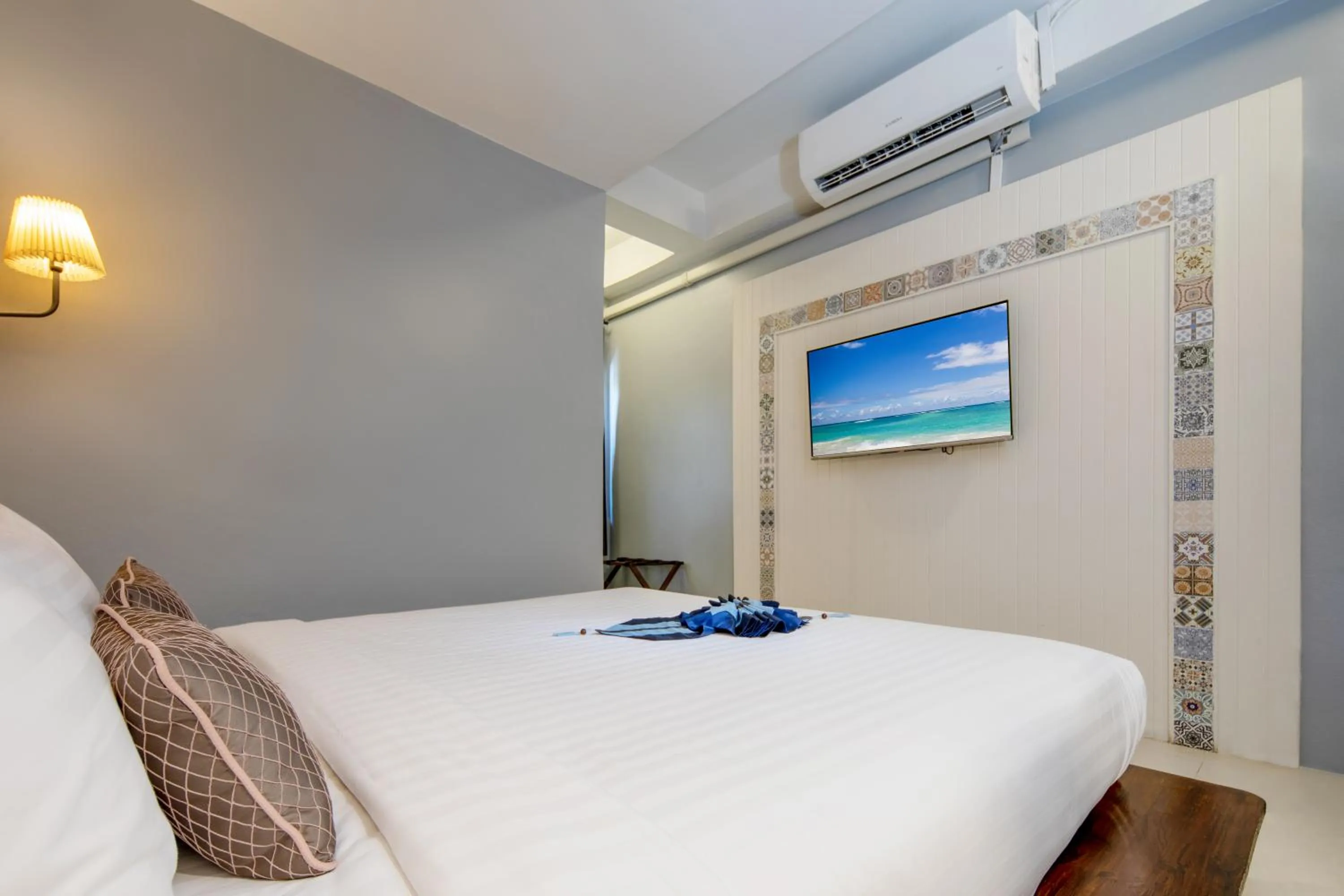 Bed in Montree Phuket Hotel