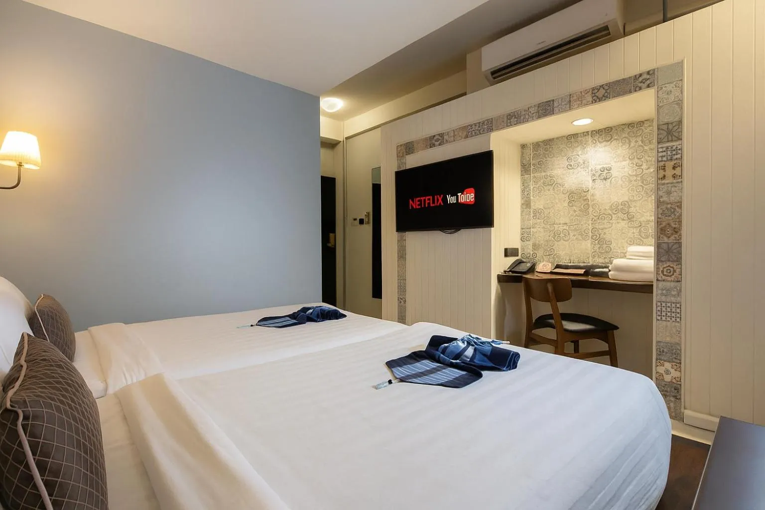 Bed in Montree Phuket Hotel