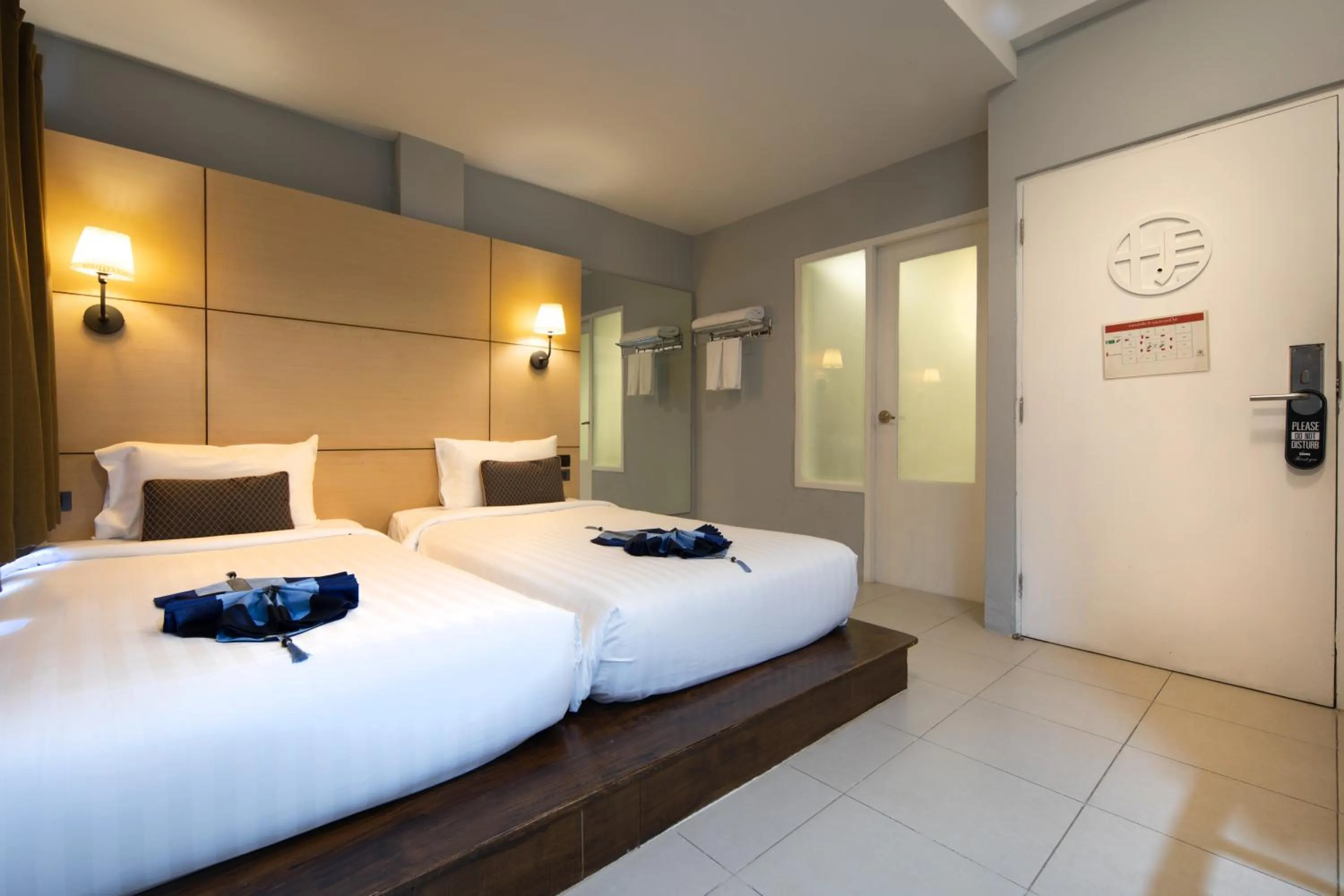 Bed in Montree Phuket Hotel