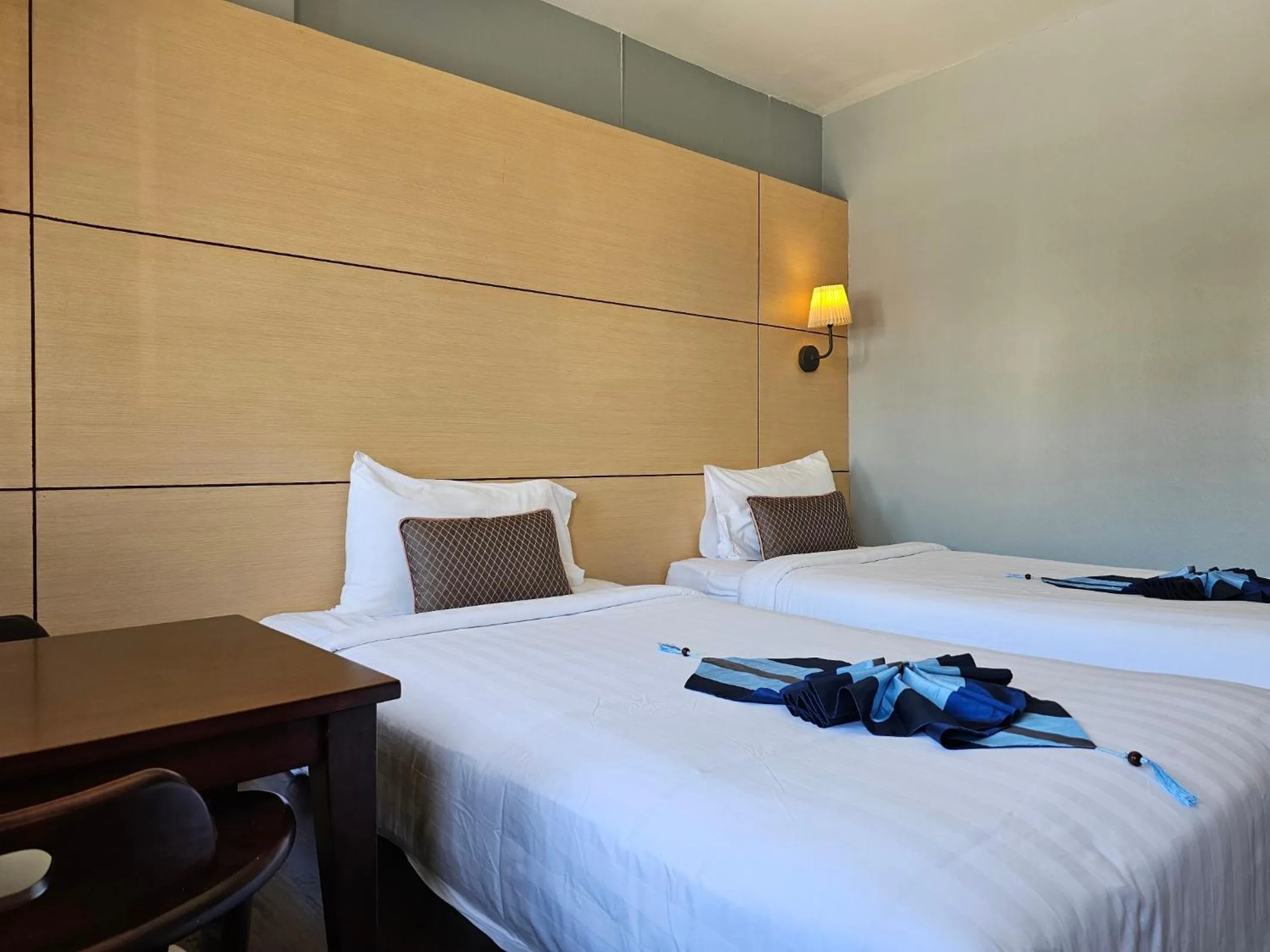 Bed in Montree Phuket Hotel