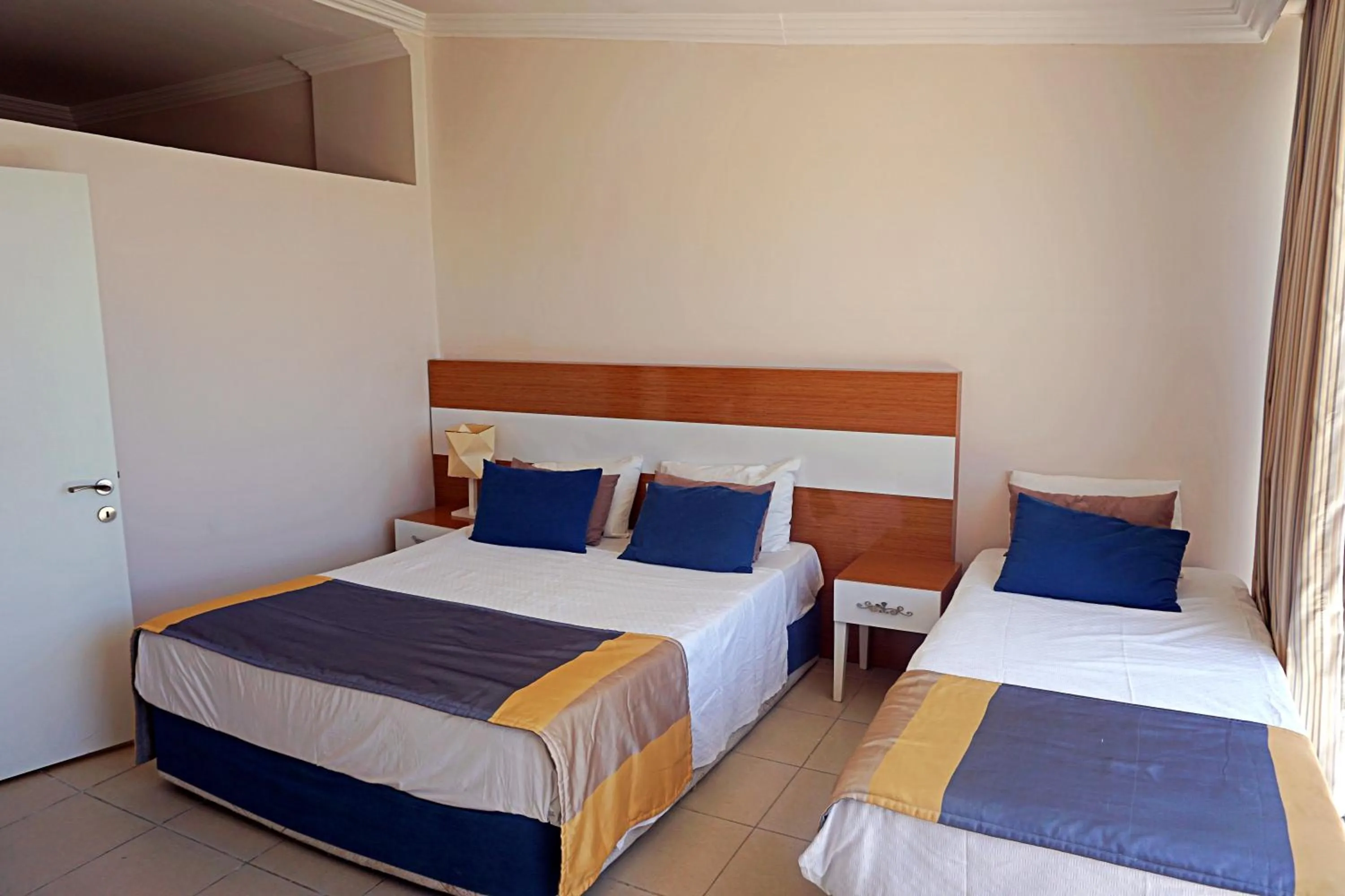 Bed in Side Legend Hotel