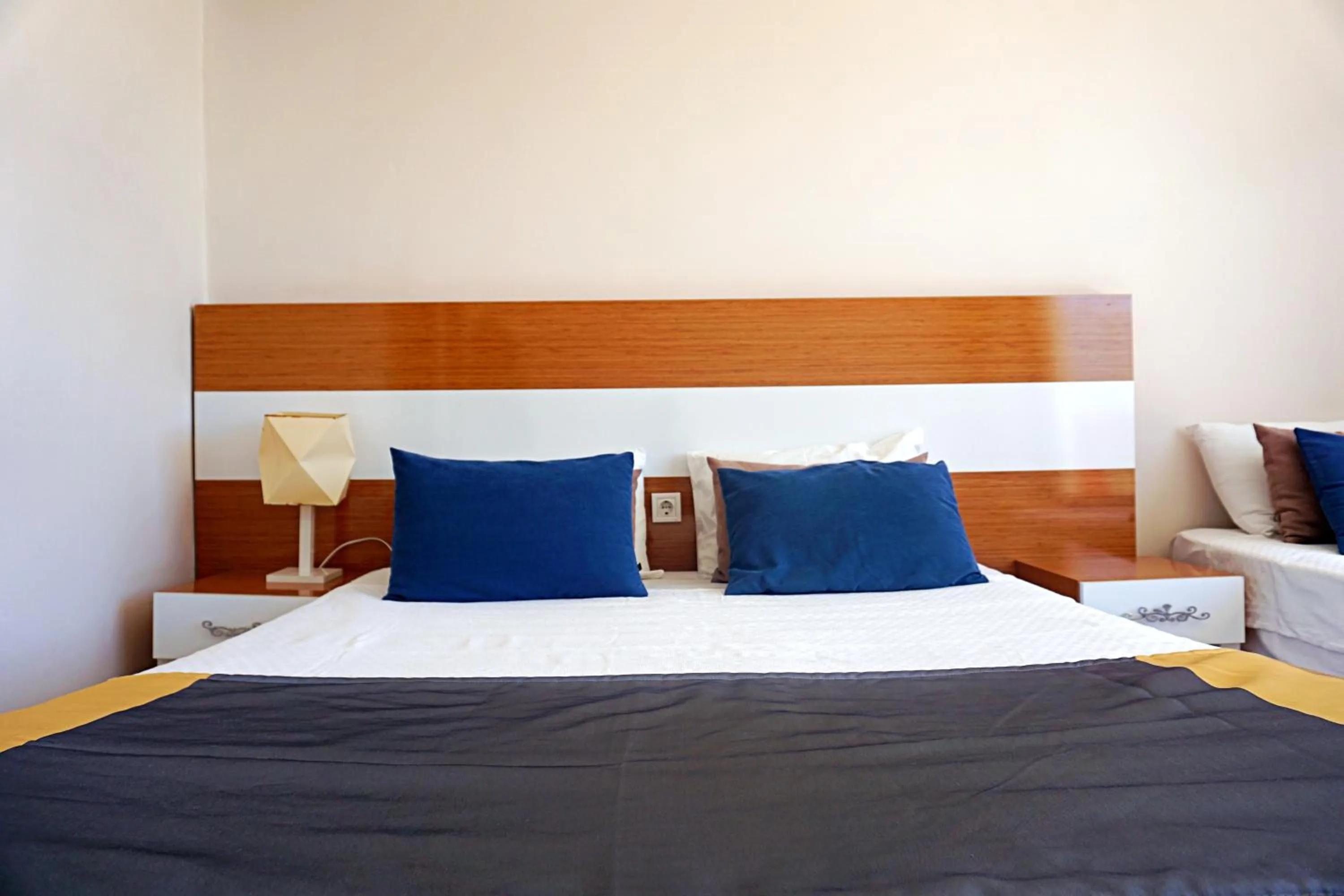 Bed in Side Legend Hotel