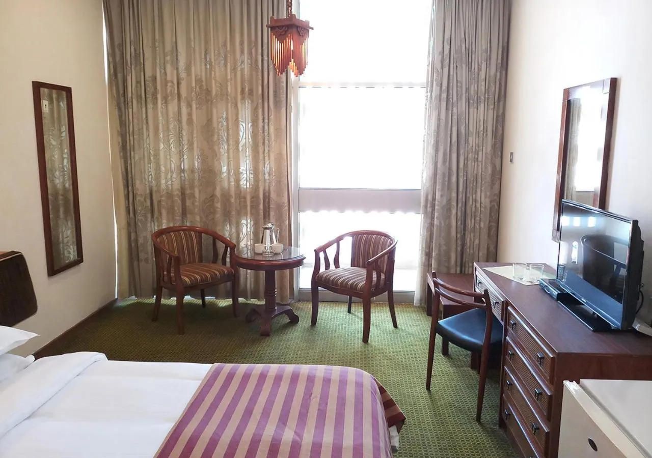 Photo of the whole room, Bed in Oriental Palace Hotel