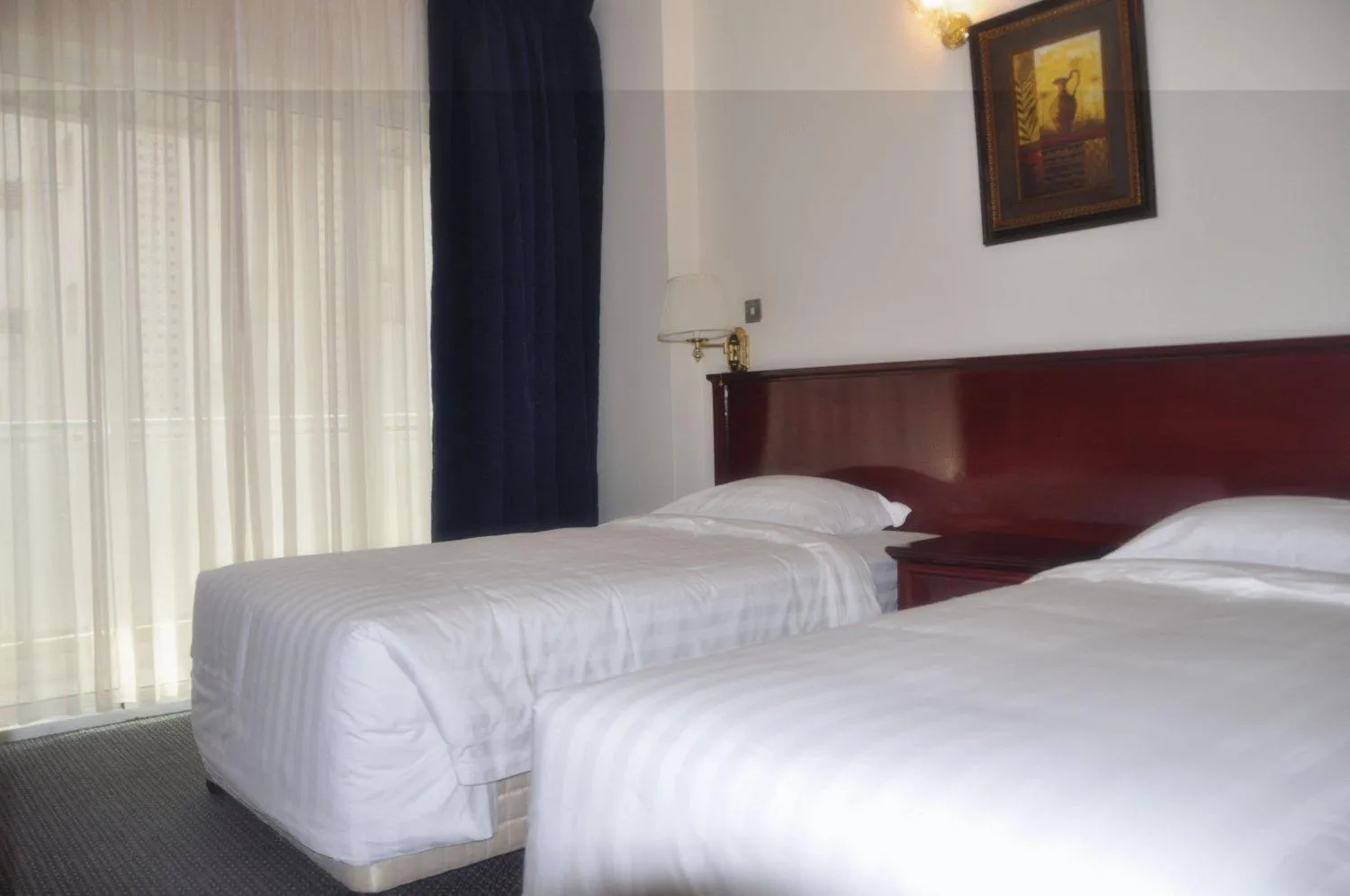 Bed in Royal Plaza Hotel Apartments