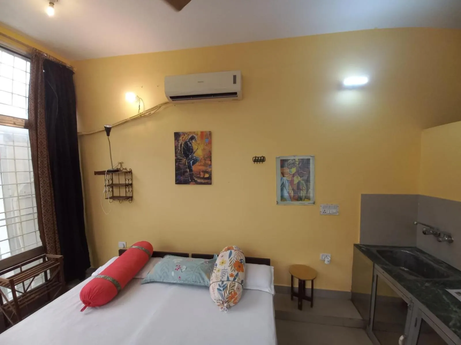 Photo of the whole room, Bed in Devi music ashram