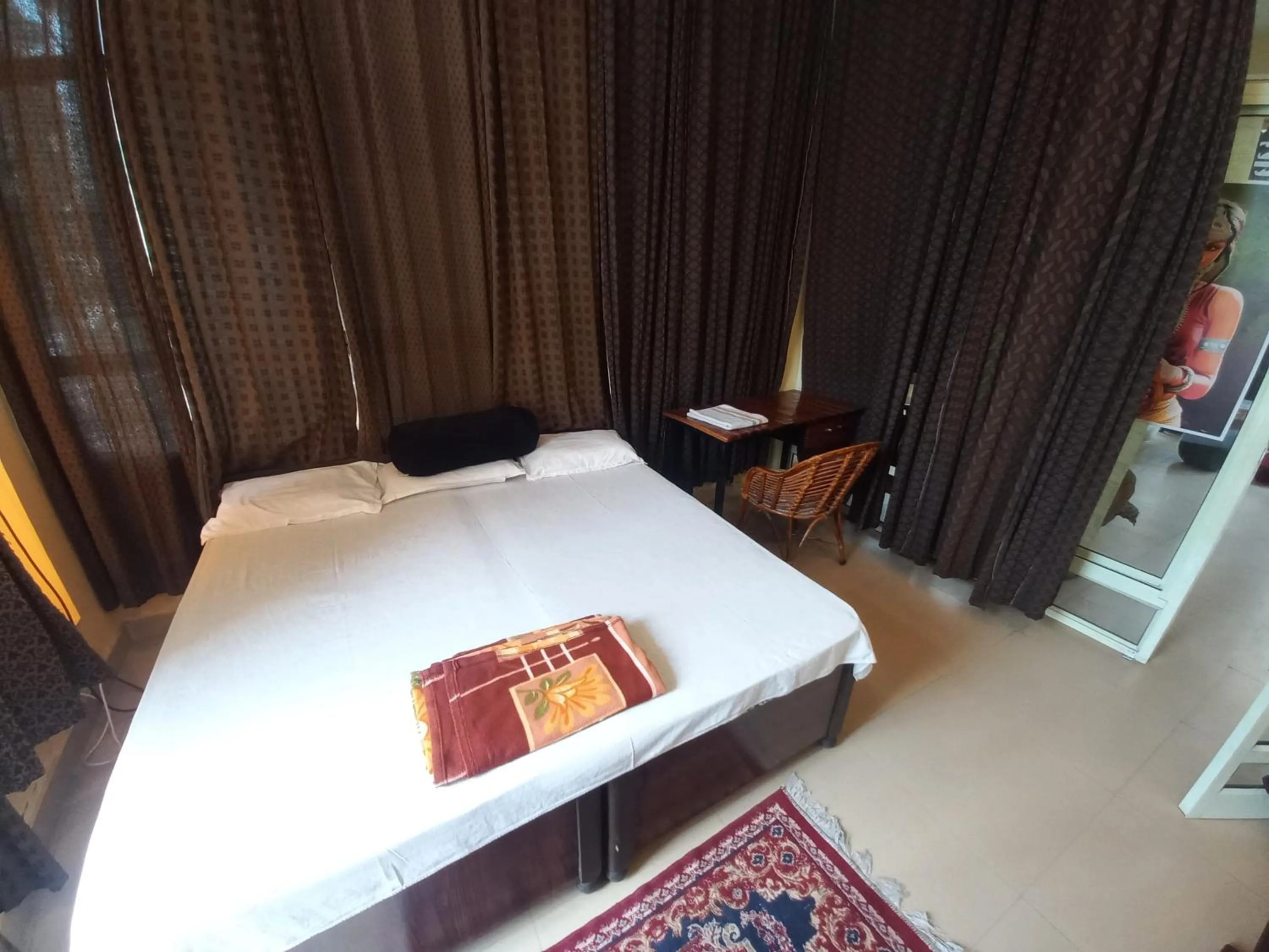 Photo of the whole room, Bed in Devi music ashram