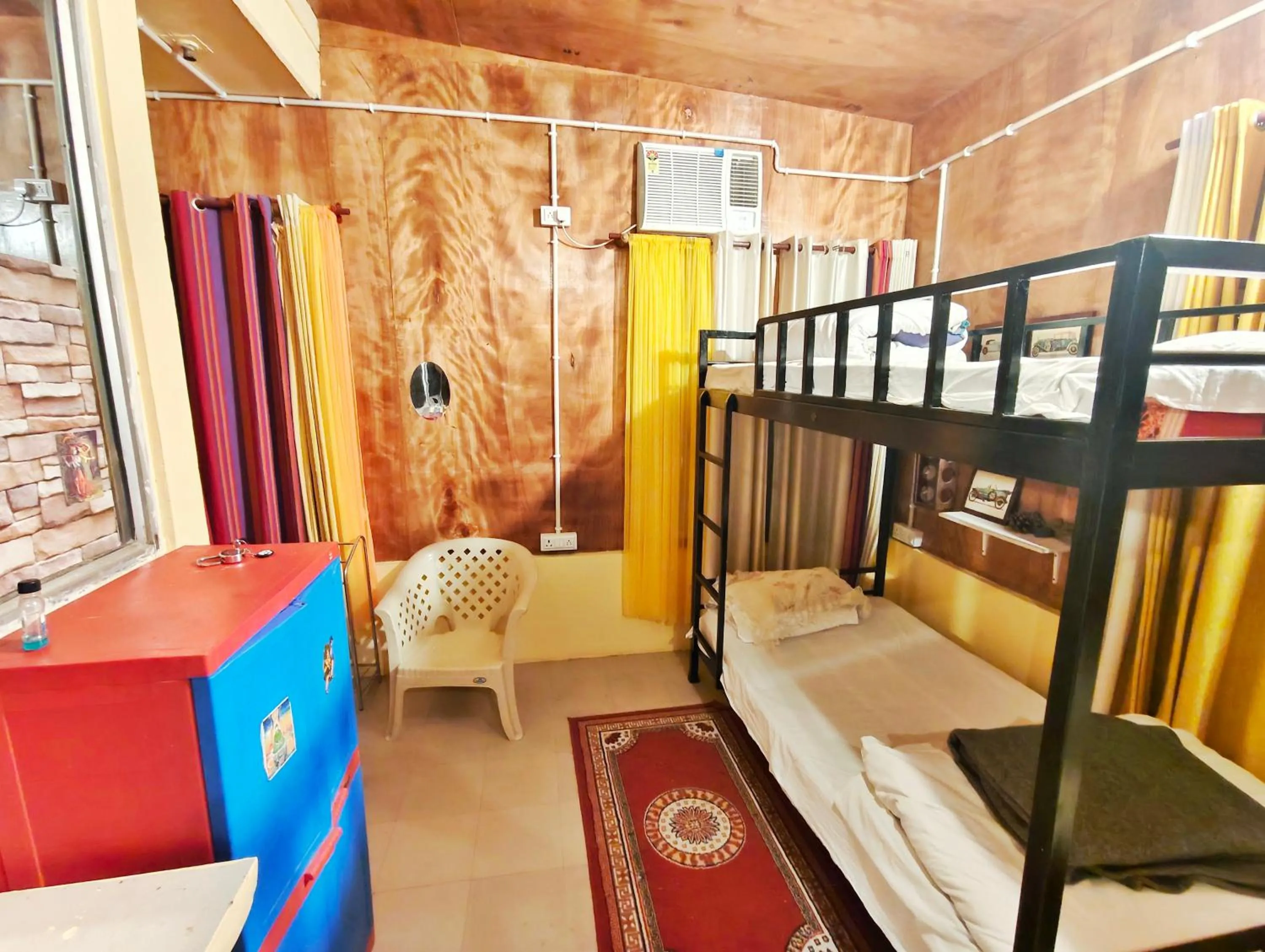 Photo of the whole room, Bed in Devi music ashram