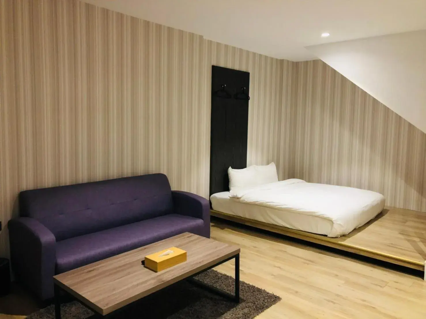 Living room, Bed in Oursea Hotel Living room, Bed in Oursea Hotel