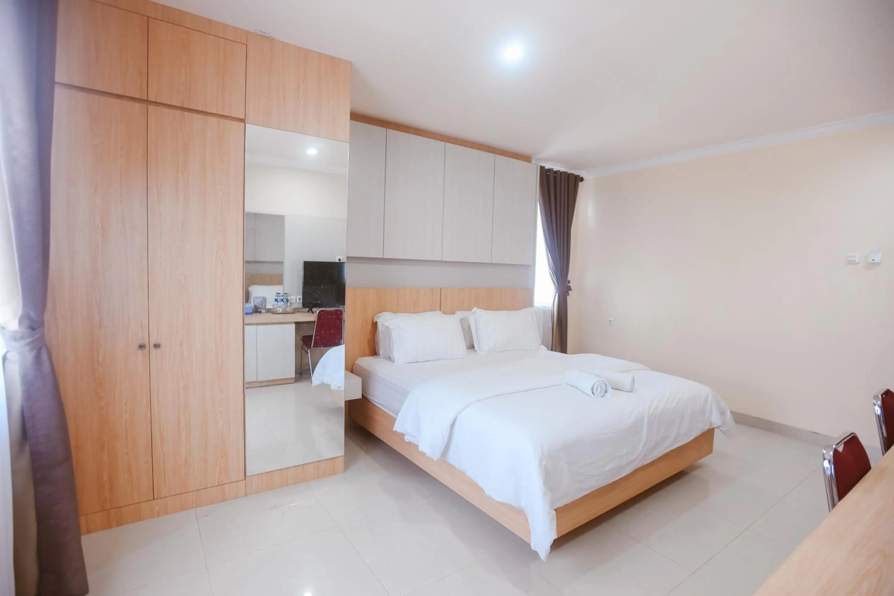 Bed in CHRYSANT HOTEL & RESORT